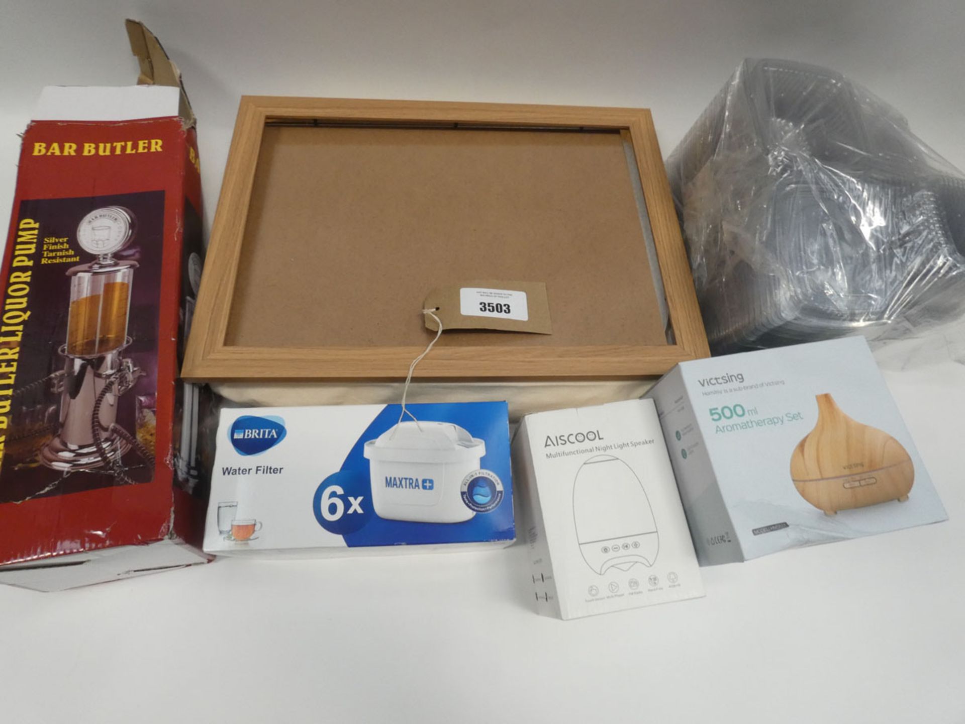 Bag containing aromatherapy set, night light speaker, bar butler, dinner tray, assortment of small