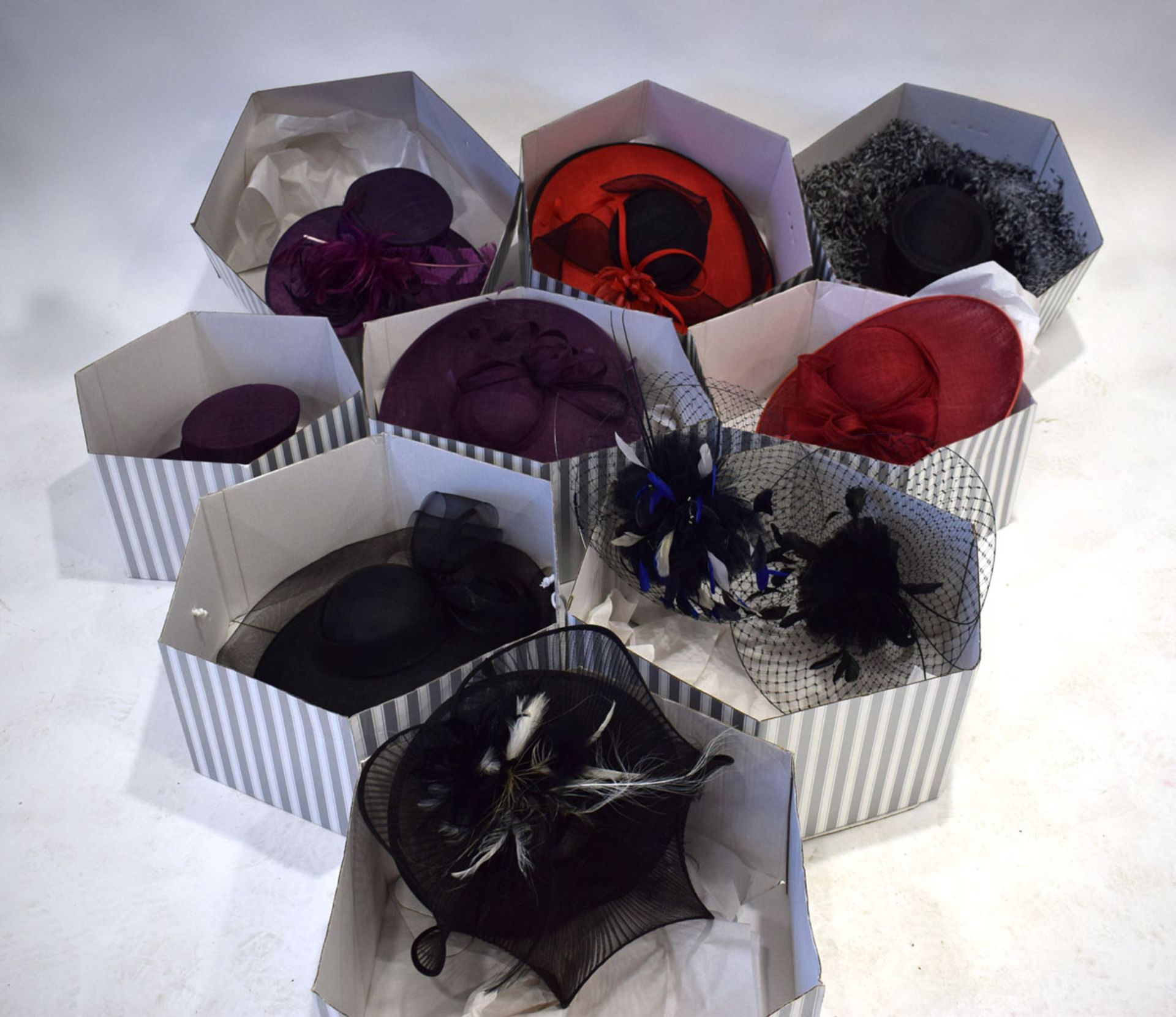 10 boxed hats and hatinators in various colours and designs