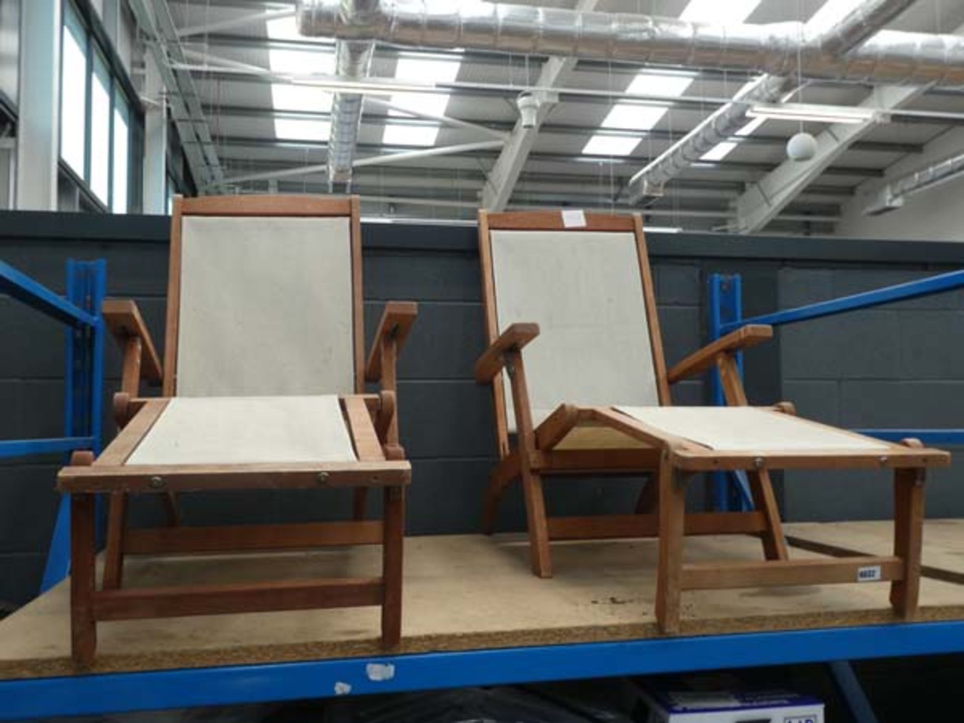 2 beige and wooden sun loungers