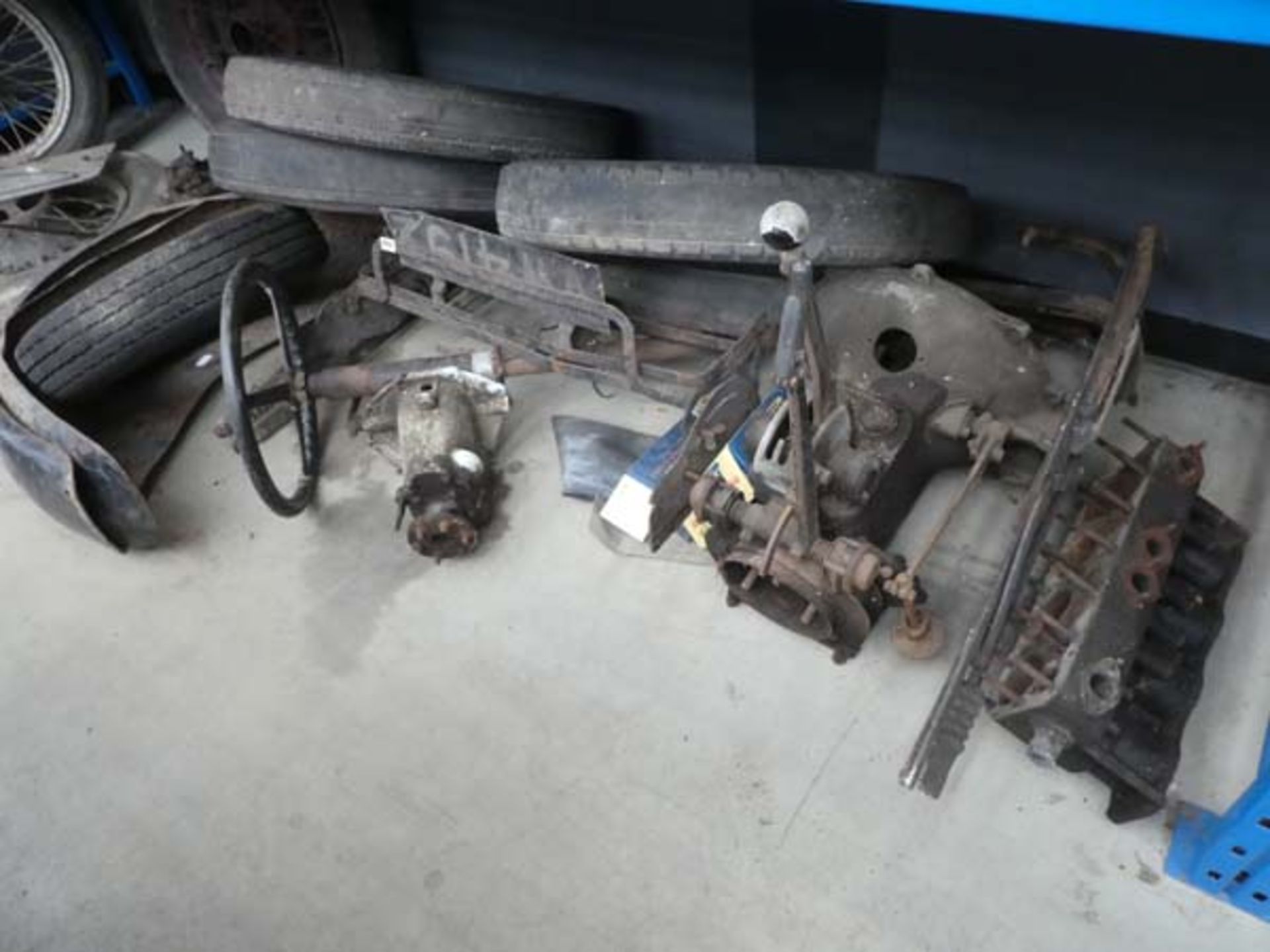 Large underbay of vintage Austin car parts to inc. spoke wheels, tyres, steering rack, part gear - Image 2 of 2