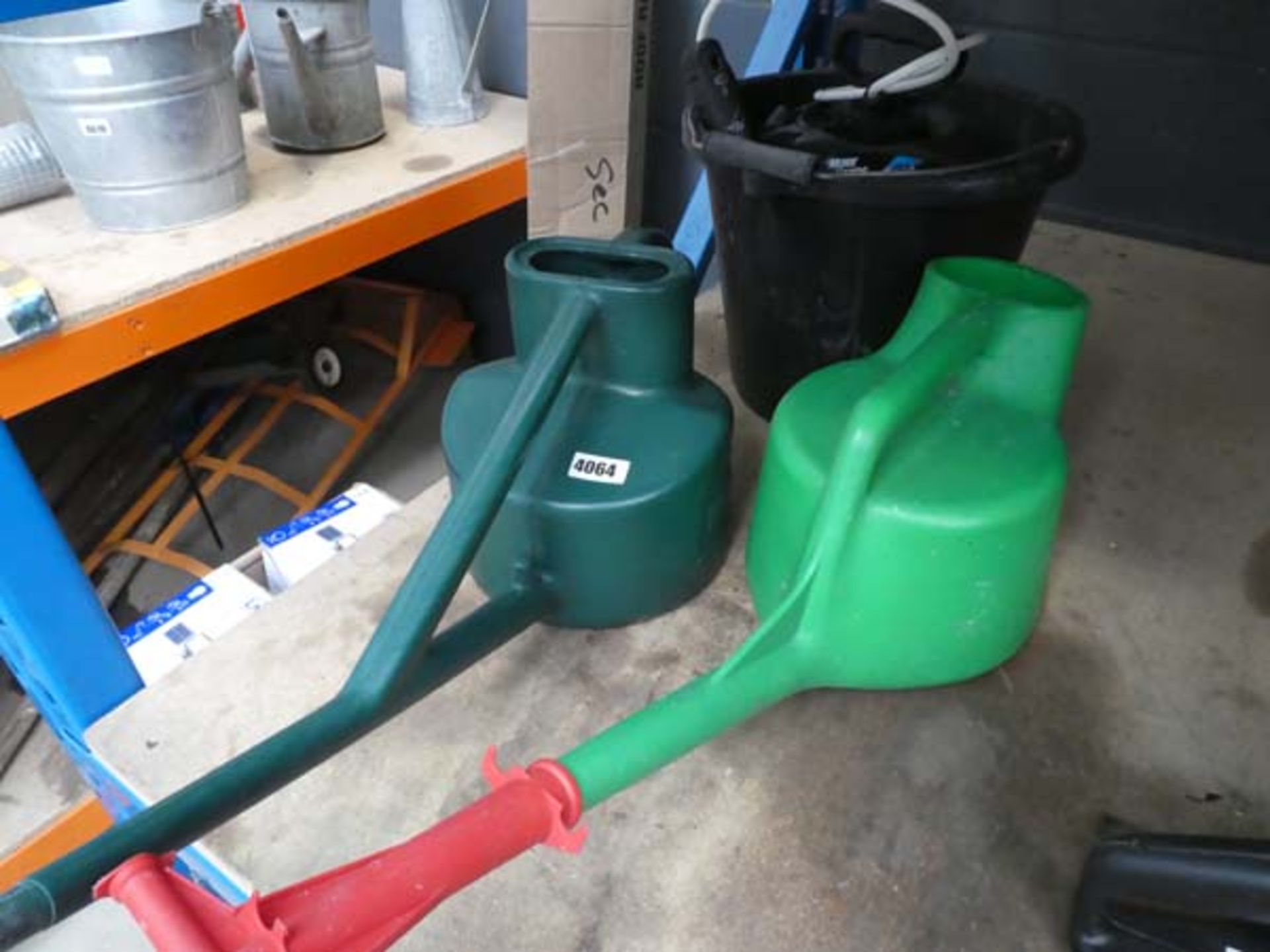 Plastic bucket and 2 watering cans