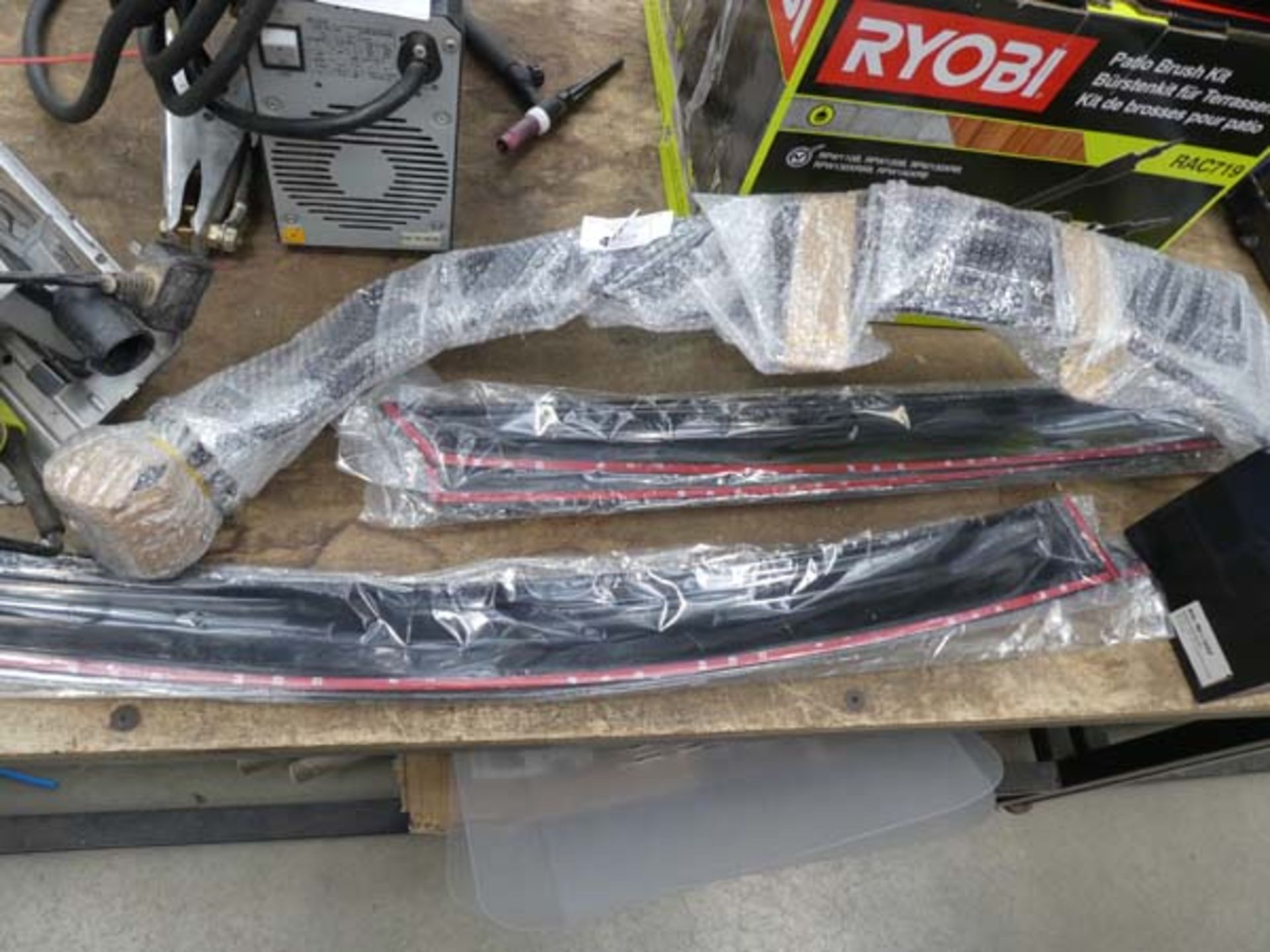 Small quantity of car parts including front grill bar and wind deflectors