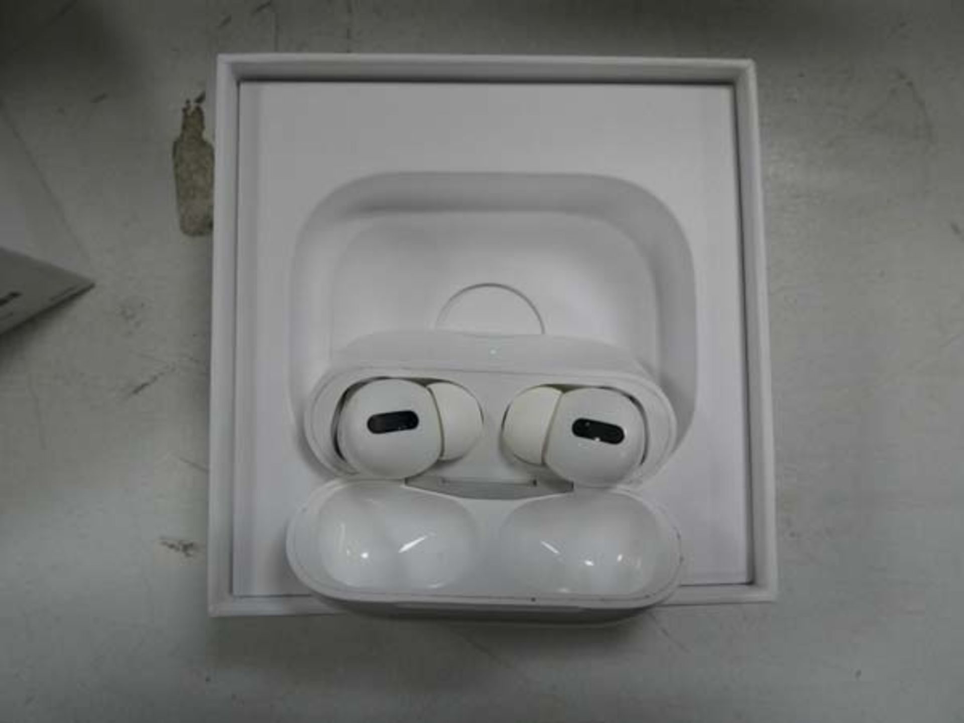 Apple AirPods Pro with wireless charging case and box