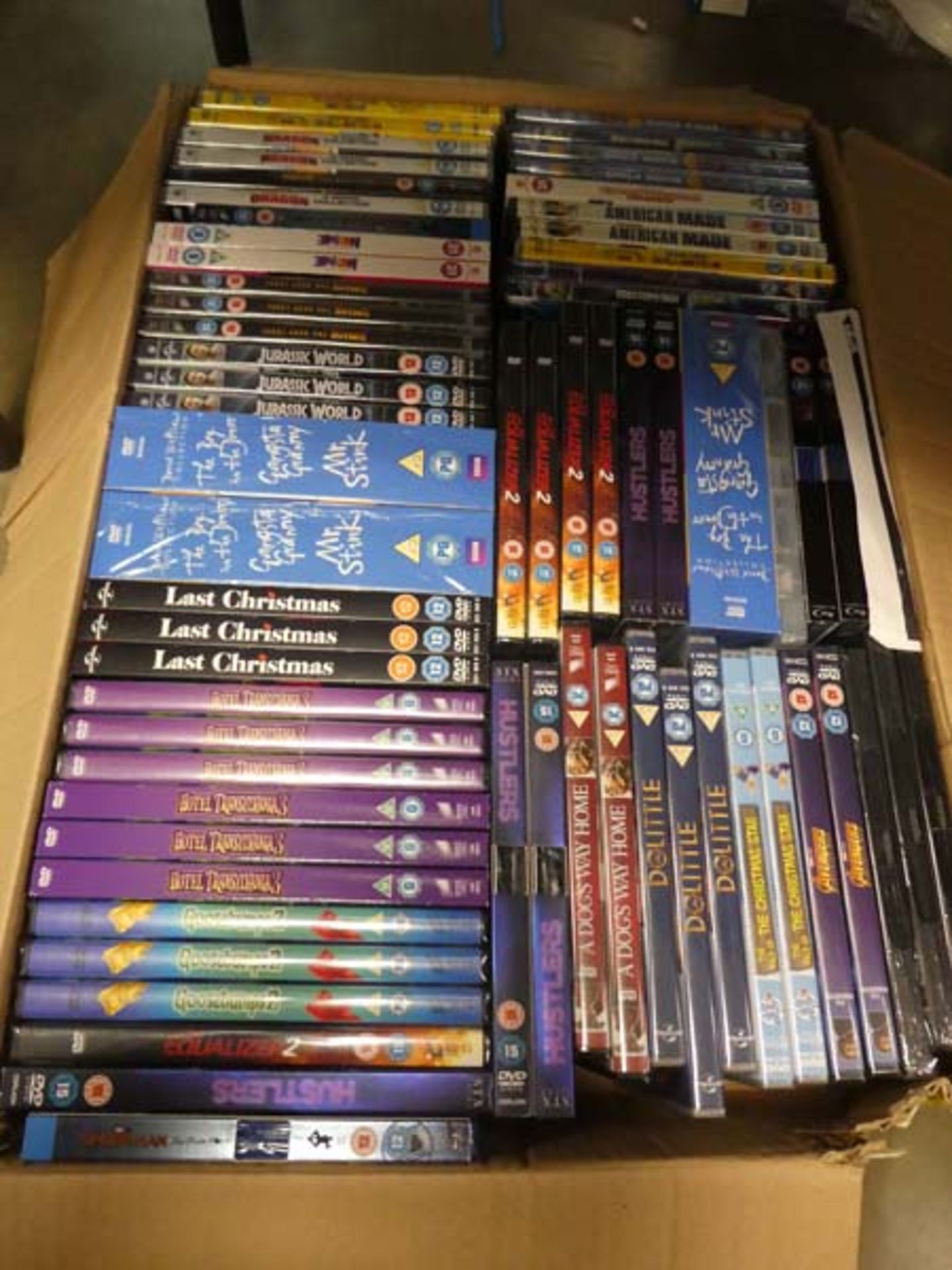 Box containing a variety of sealed DVD's to inc. Equaliser 2, Hustlers, etc