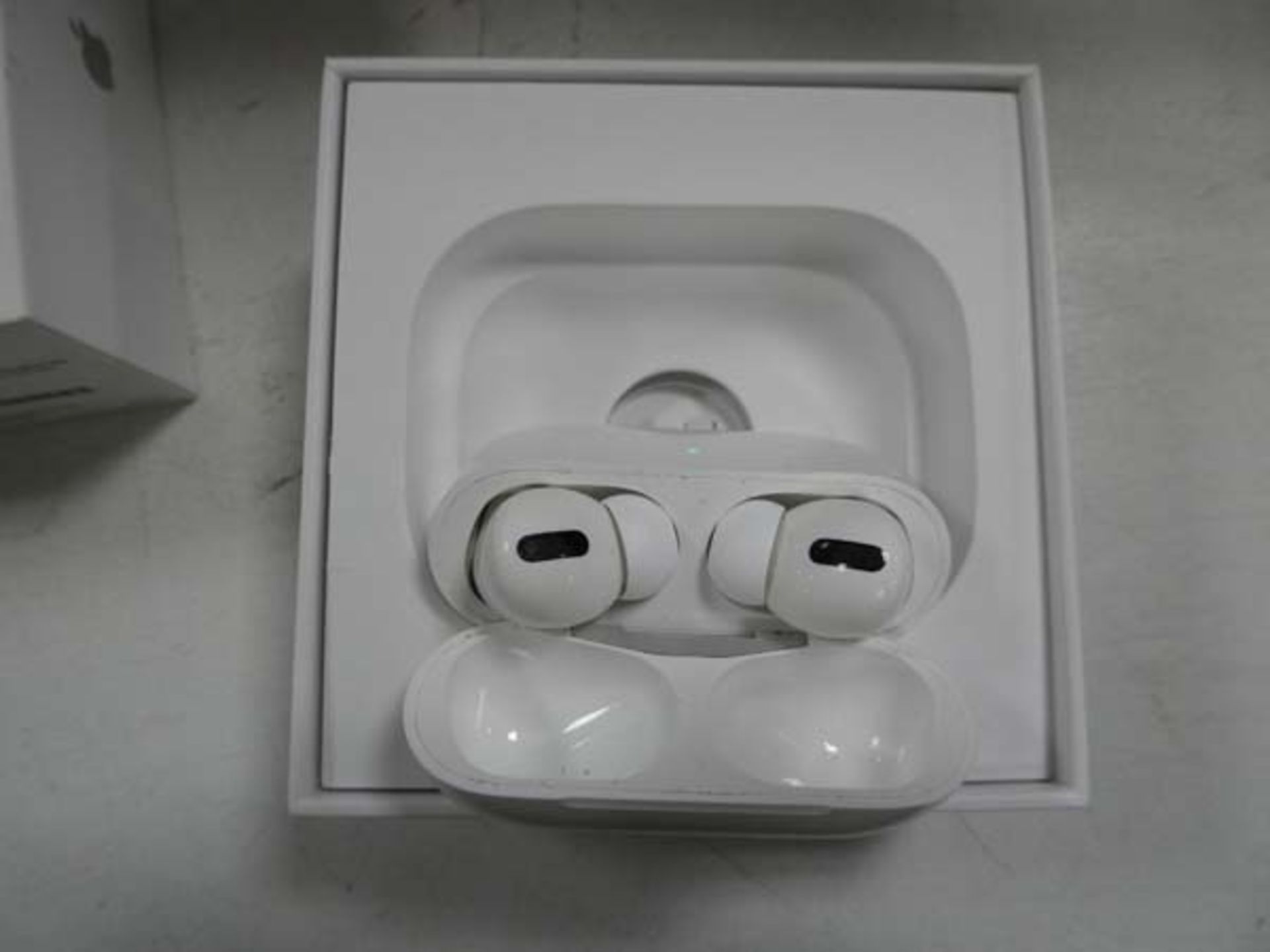 Apple AirPods Pro with wireless charging case and box
