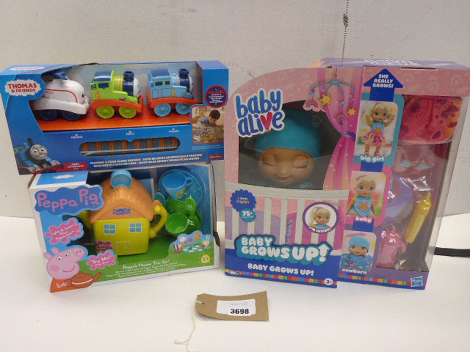 Baby Alive Baby Grows Up! doll, Peppa Pig tea set and Thomas & Friends Playmat & push along friends