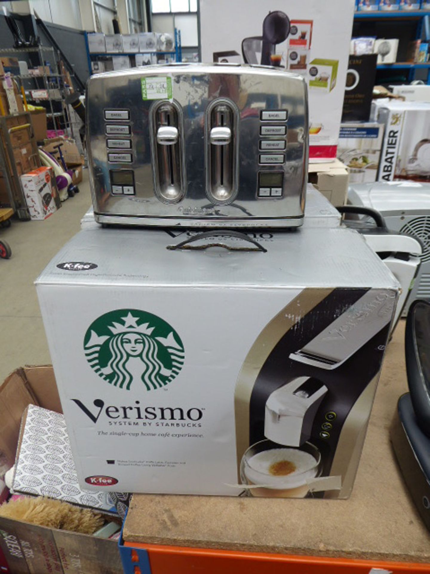 Four slice Delonghi toaster, two Verismo Starbuck coffee machines etc