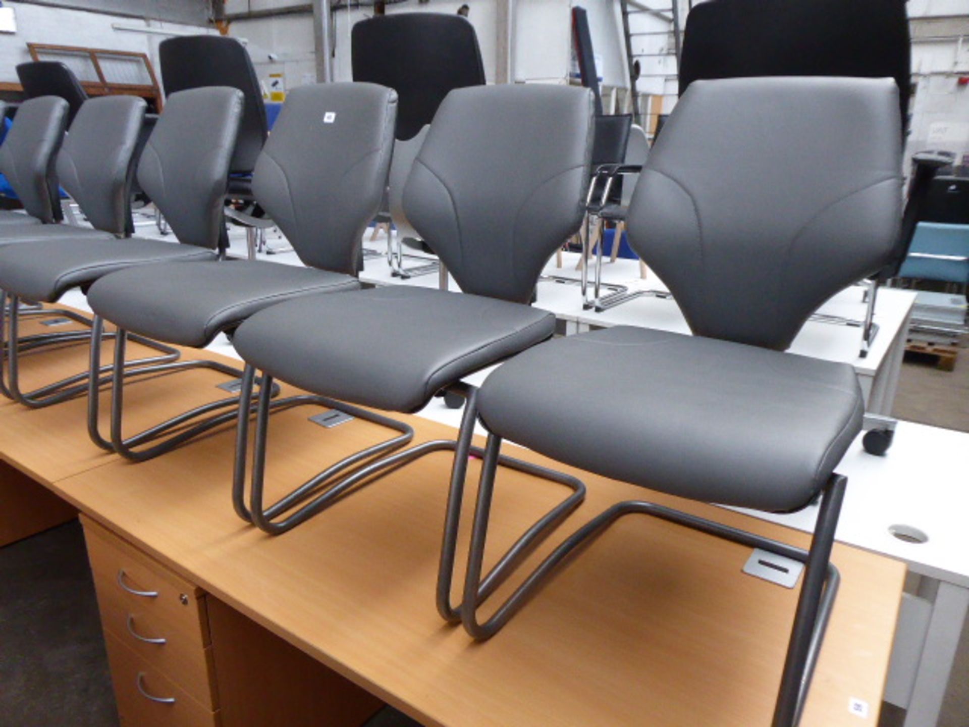 Four grey metal framed grey leather effect seat and seat back cantilever reception chairs