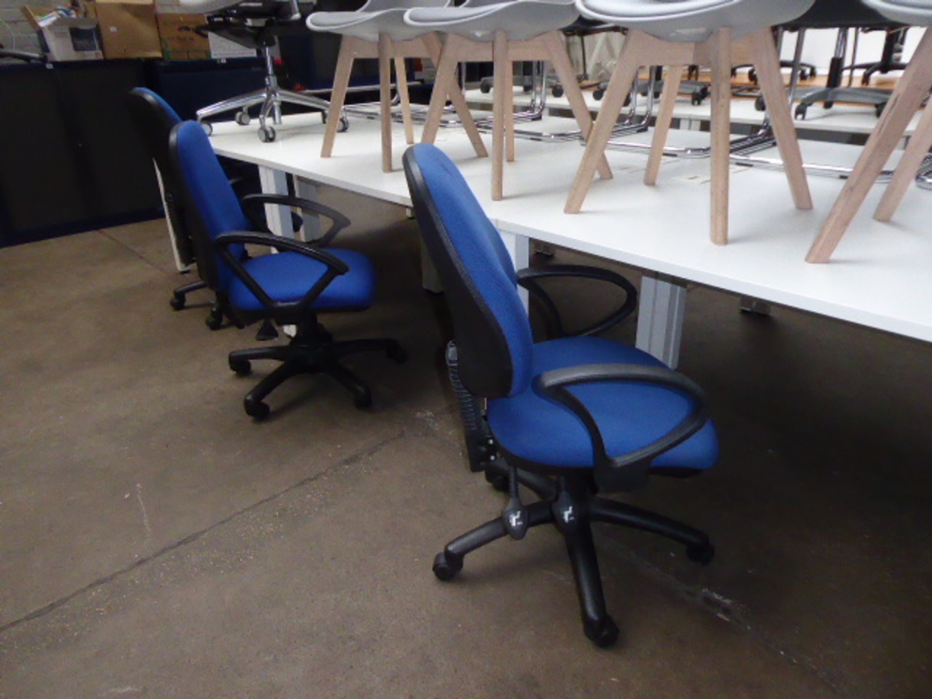 Six blue cloth swivel arm chairs