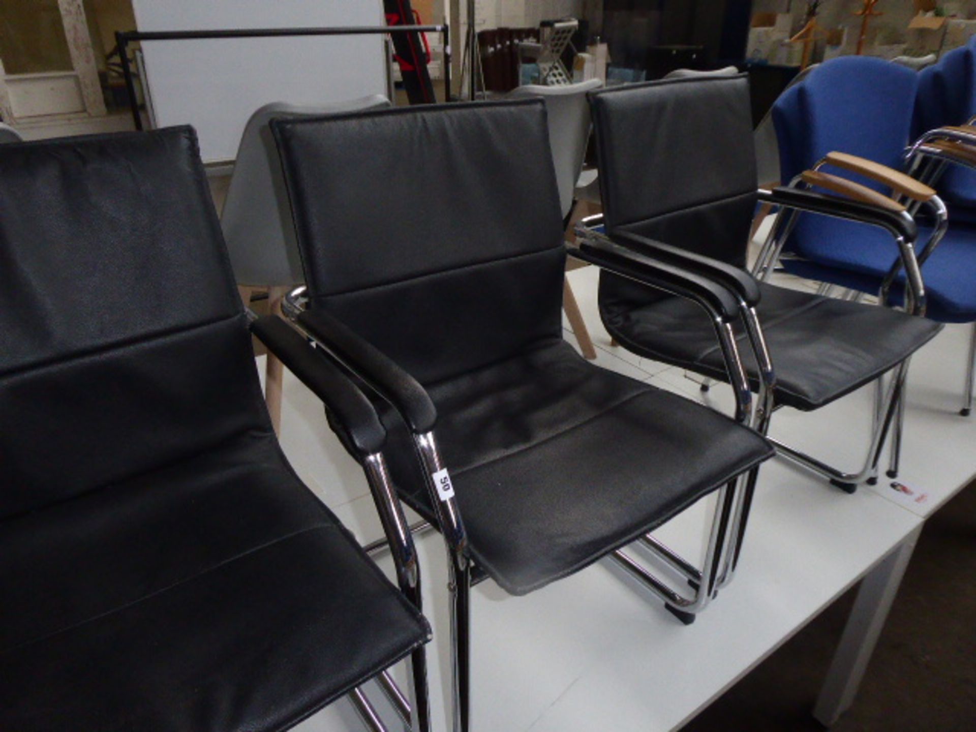 Four black leather effect and chrome frame cantilever chairs - Image 2 of 2