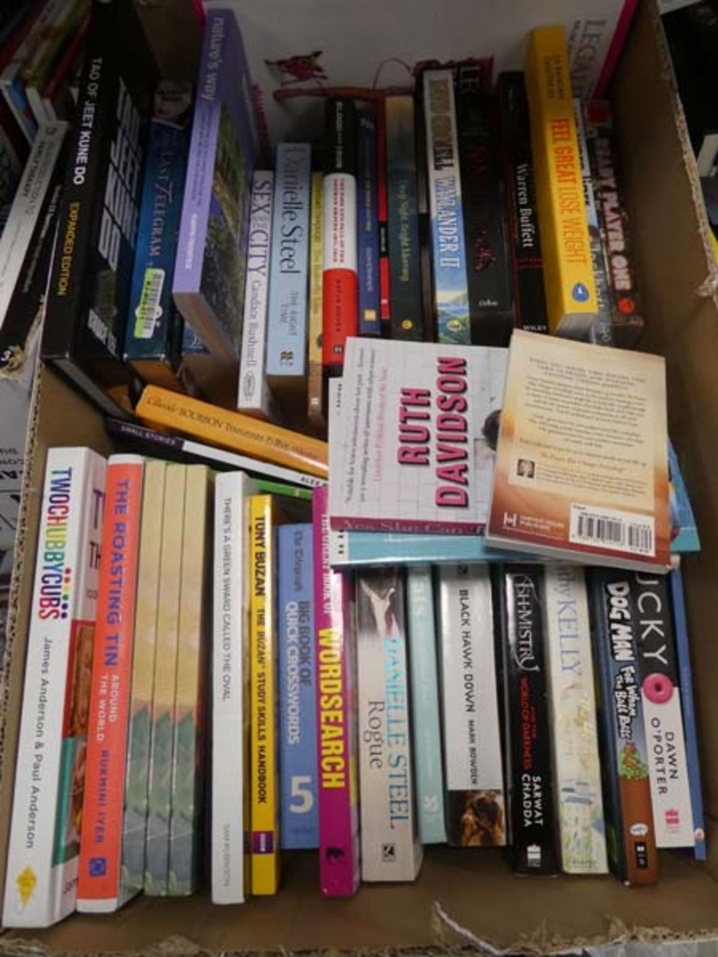 Box containing various hard back and paper back novels