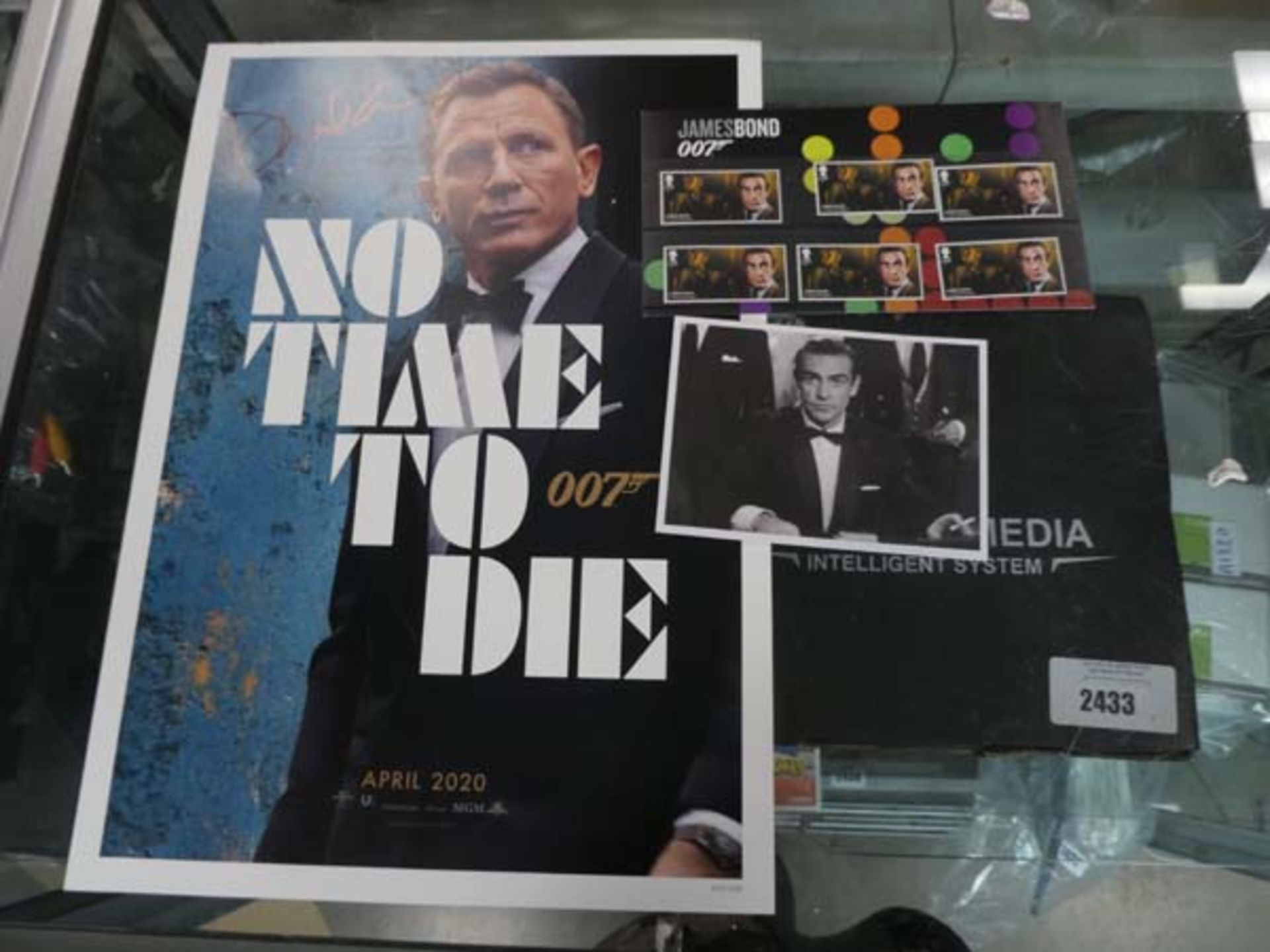 James Bond No time To Die poster bearing signature and James Bond 007 stamp set, no certification