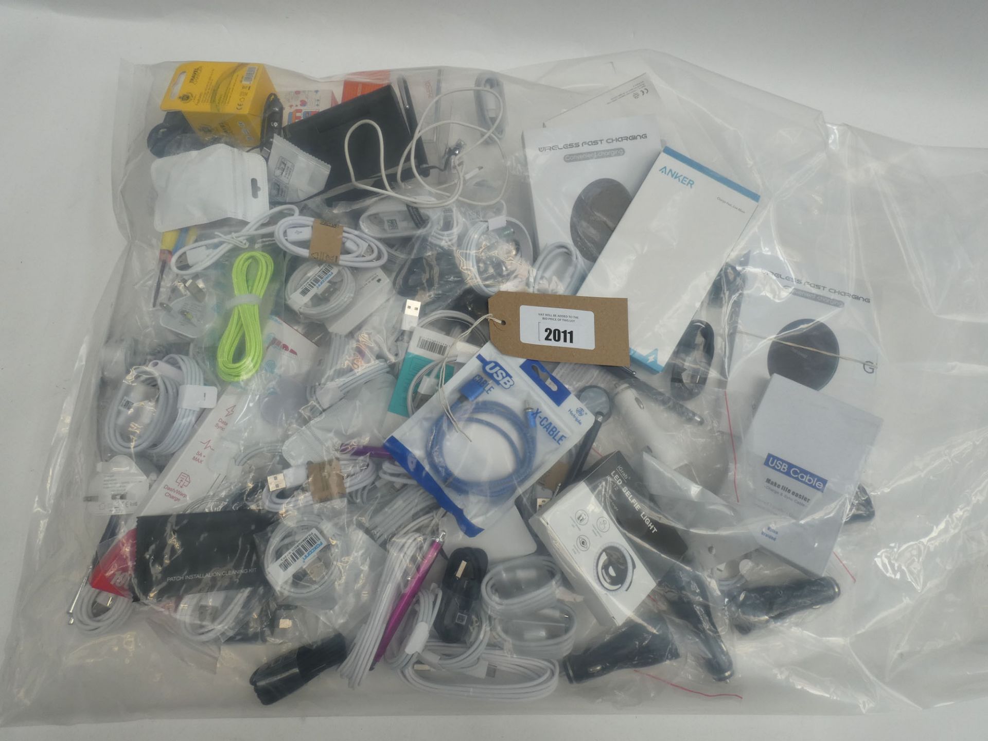 Bag containing quantity of mobile phone accessories; cables, adapters, wireless chargers,