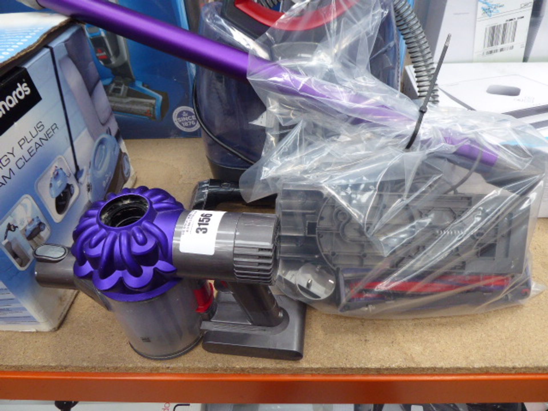 Hand held Dyson V6 Animal vacuum cleaner, together with pole, head, charger and some attachments All