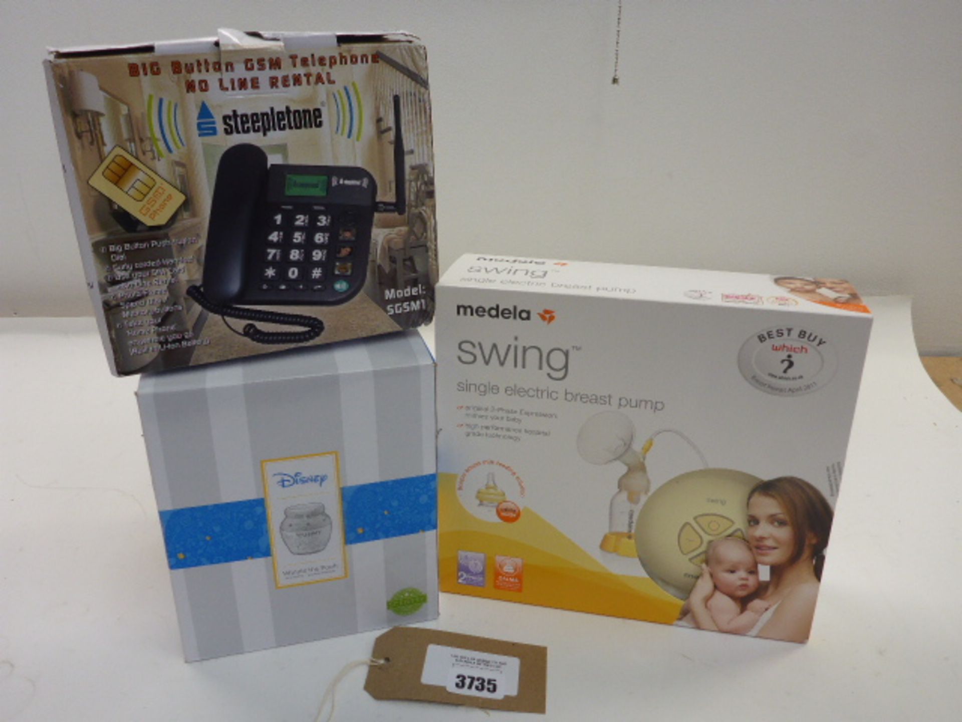 Medela swing single electric breast pump, Steepletone big button telephone and Disney Scentsy warmer