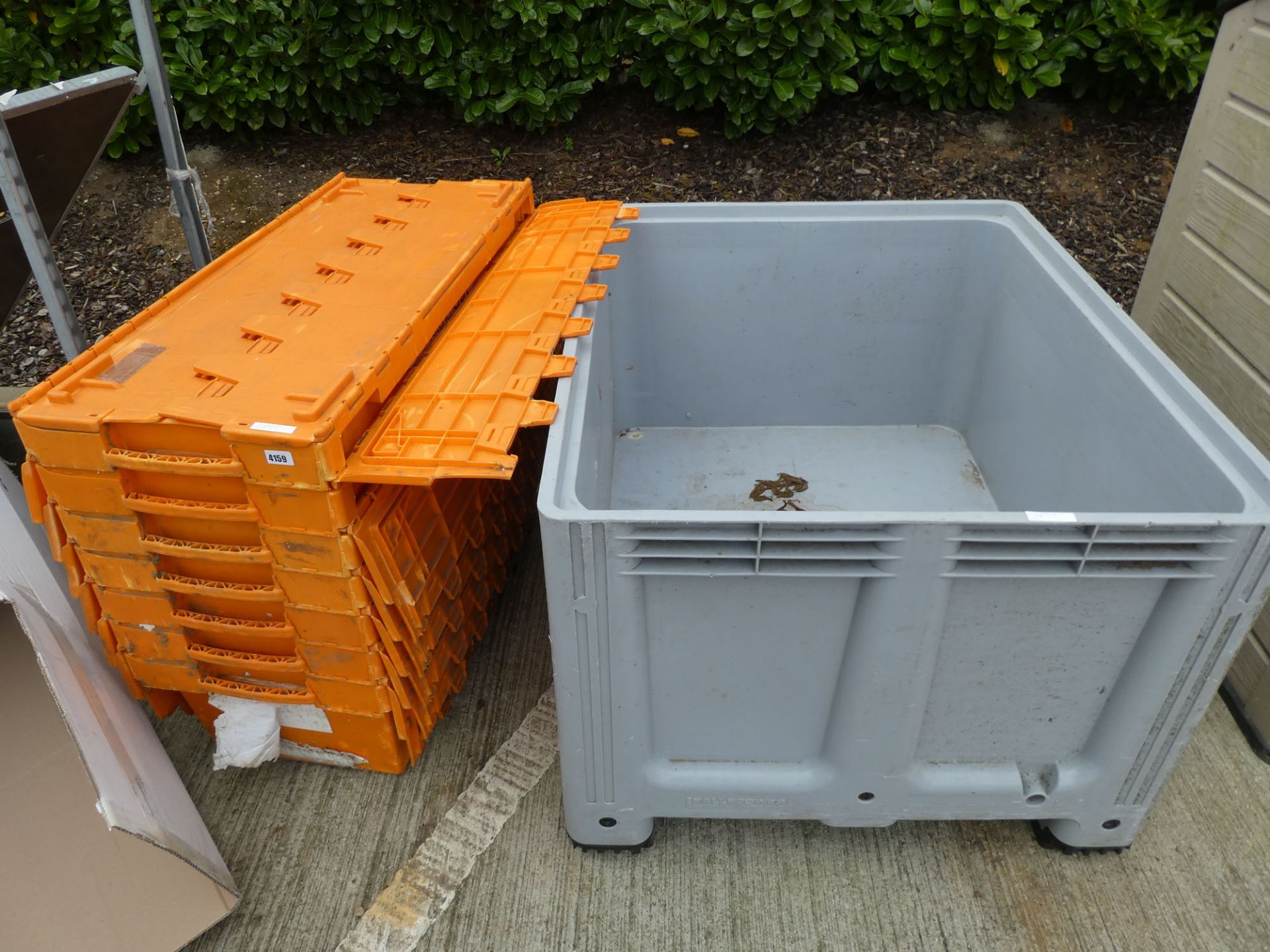 4121 - Orange plastic stacking crates and a large grey crate