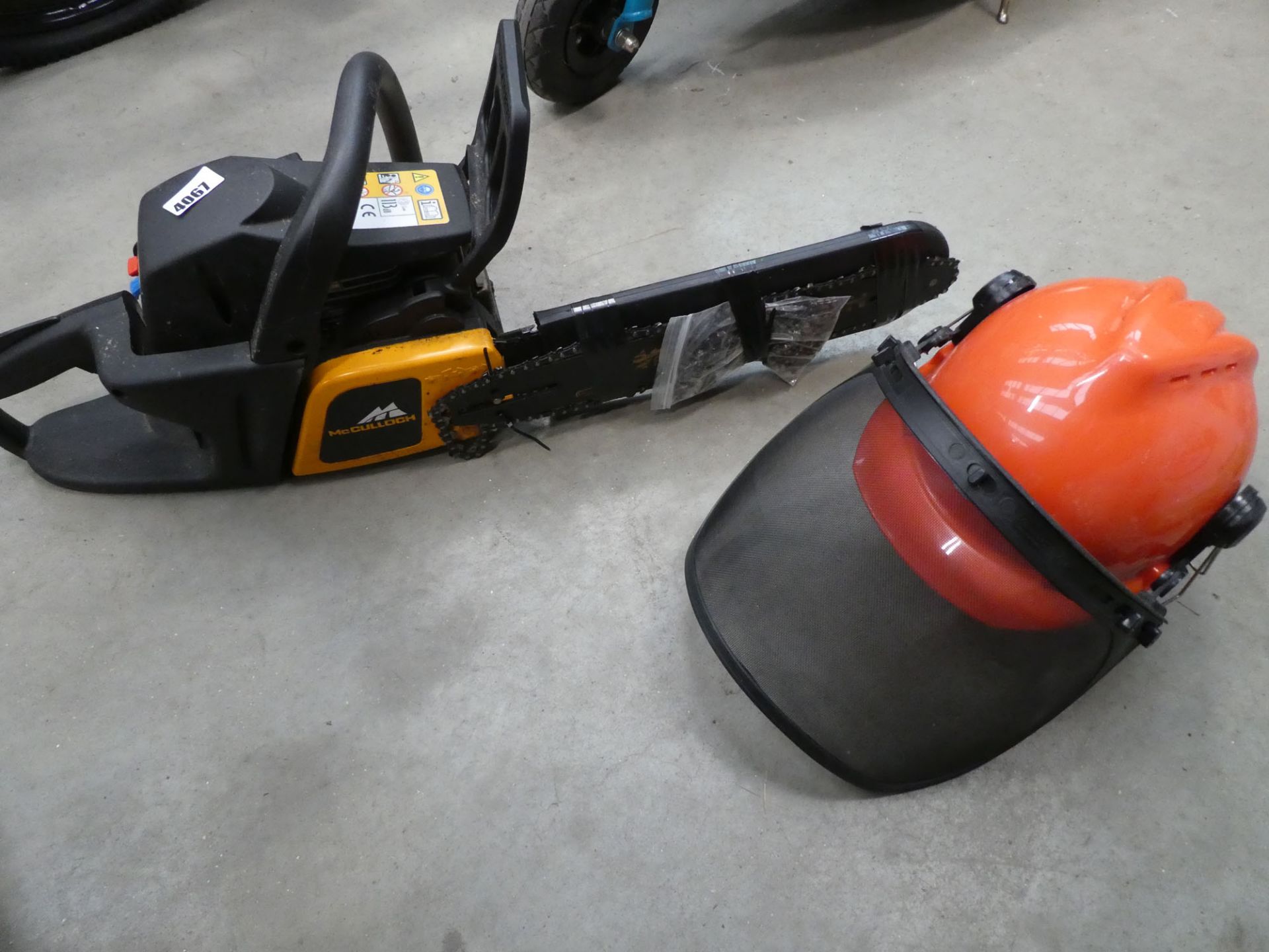 McCulloch petrol powered chainsaw and a chainsaw helmet