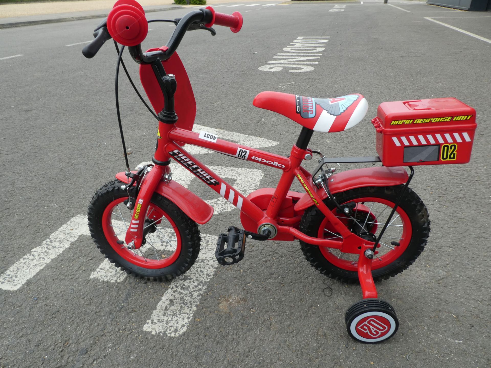 Red small Fireman Sam childs bike with stabilisers