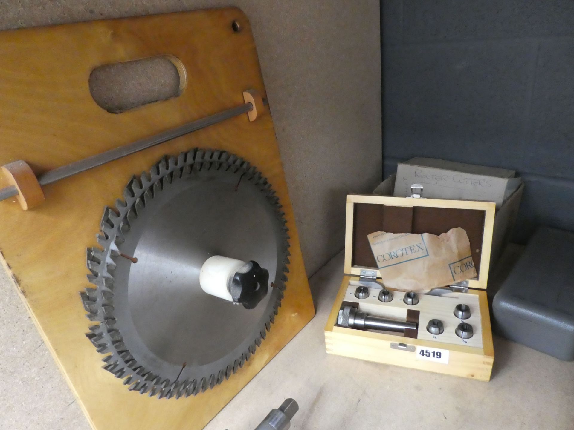 Corotex Modelo collet chuck with saw blades, router cutters, blades and an empty grey box