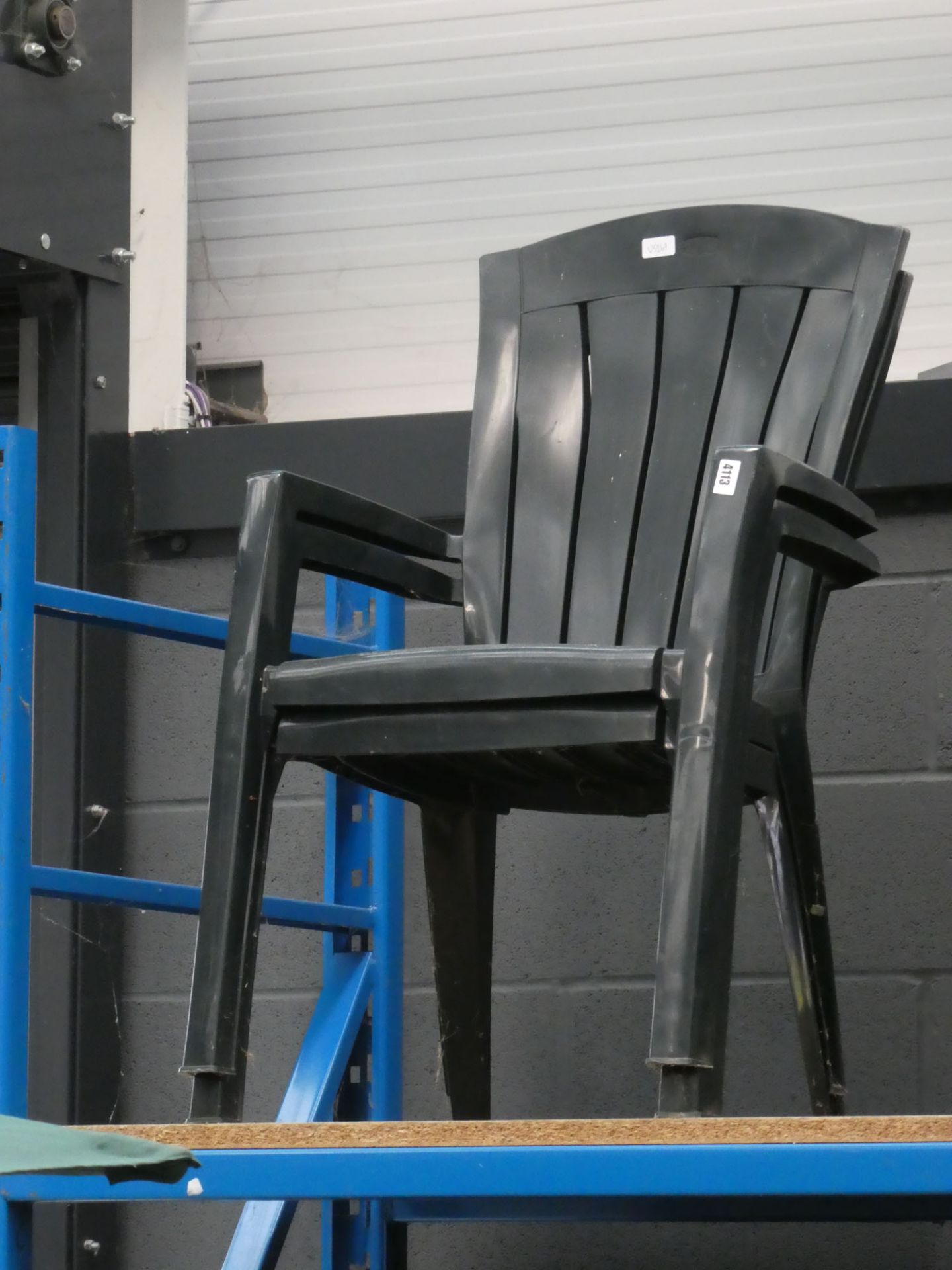 2 plastic stacking chairs