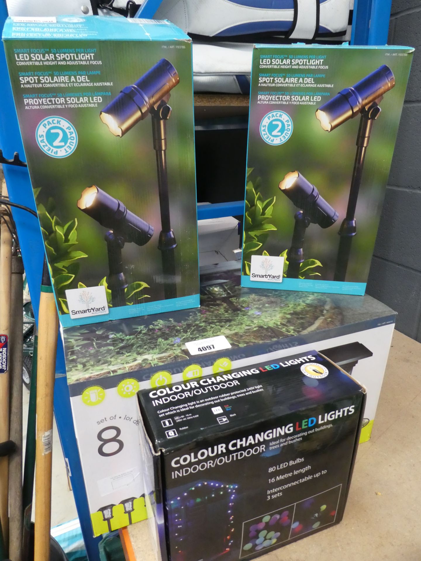 2 boxes of LED solar spotlights, box of solar pathway lights and colour changing LED lights