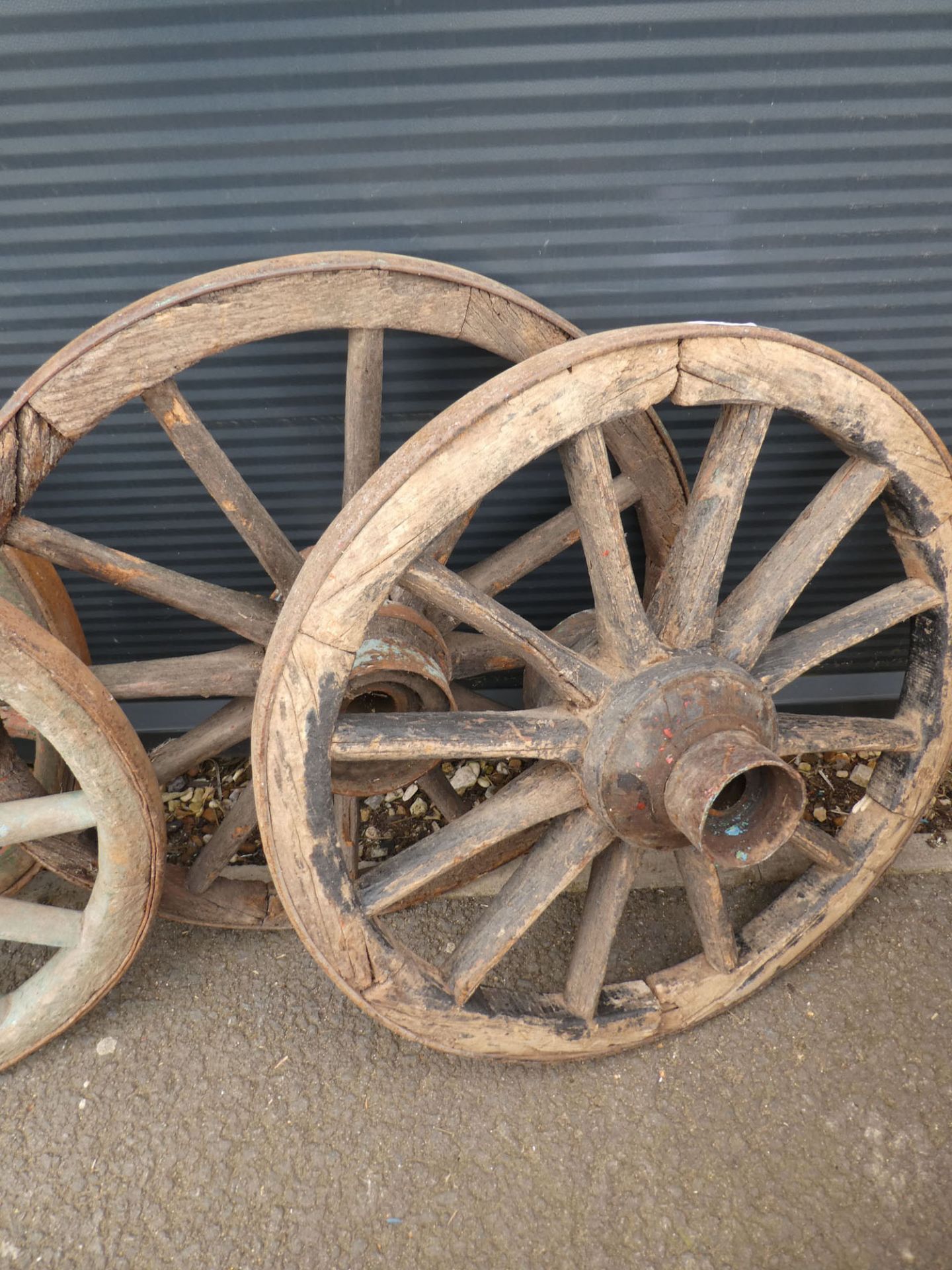 2 vintage cart wheels