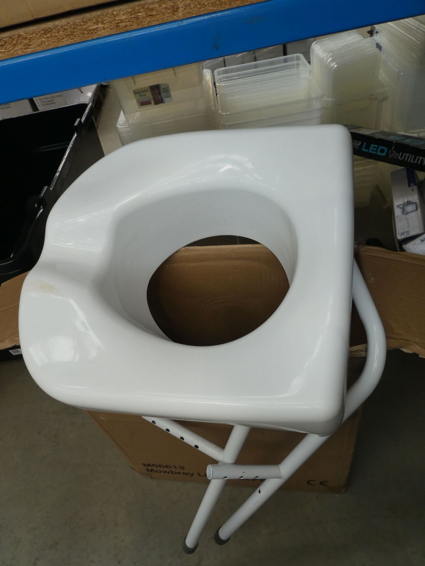 Flat pack commode seat