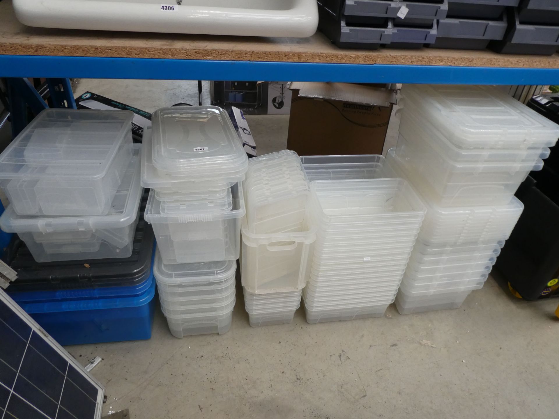 Quantity of clear plastic storage boxes