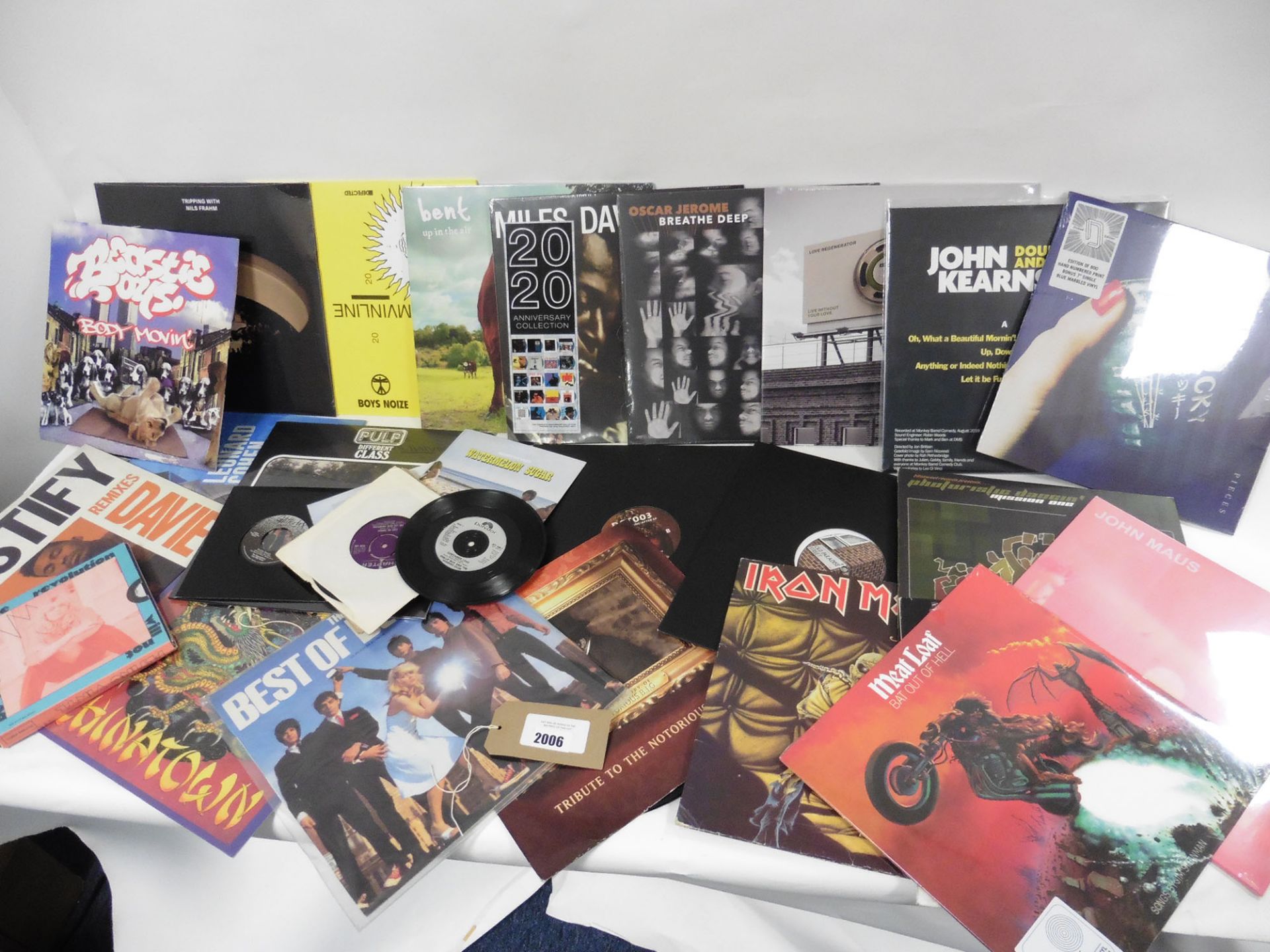 Bag of records about 22 LP vinyl albums and about 11 singles inc Iron Maiden, Blondie, Harry