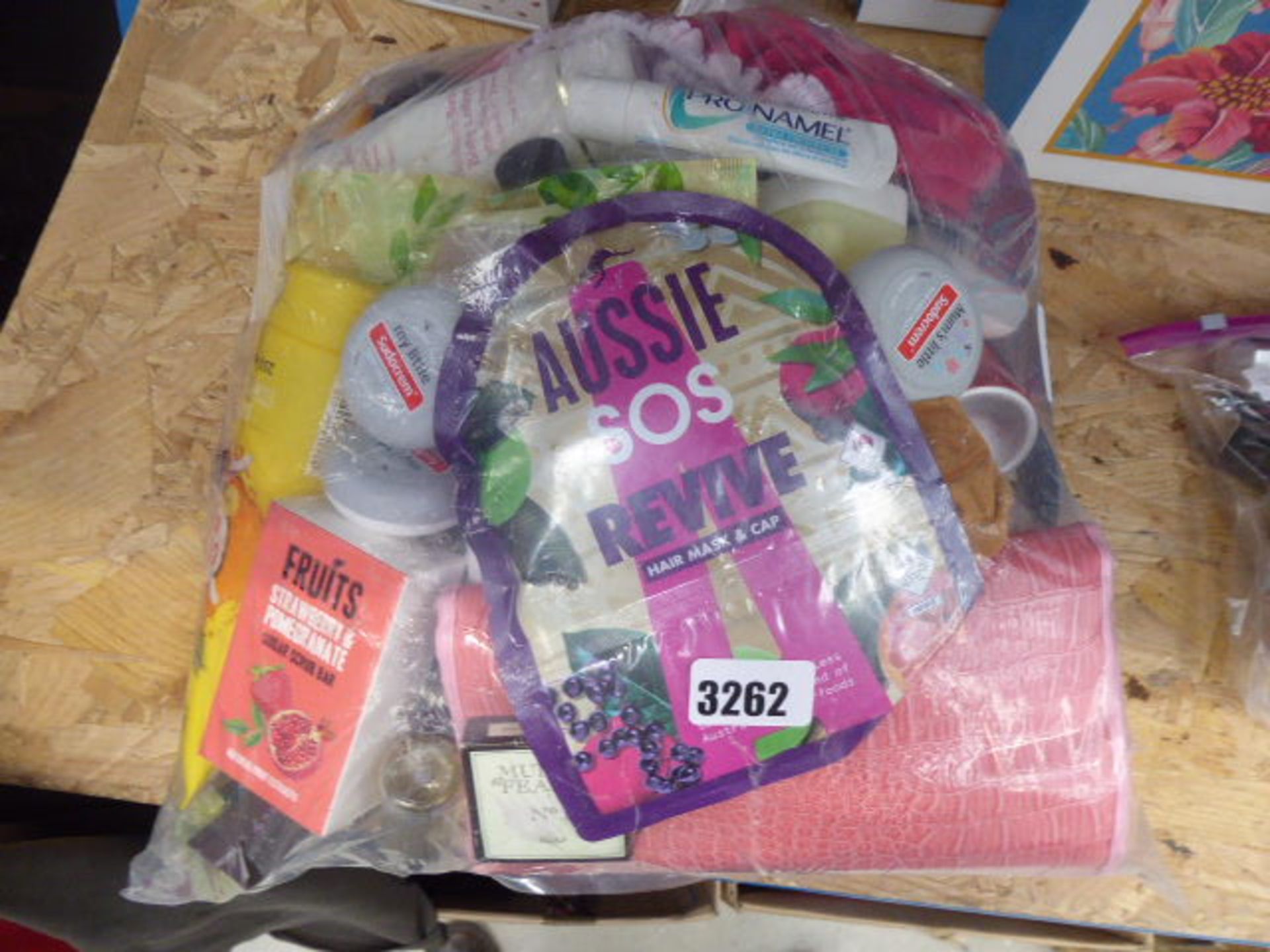 Large bag containing hair masks and caps, scrub bars, creams etc.