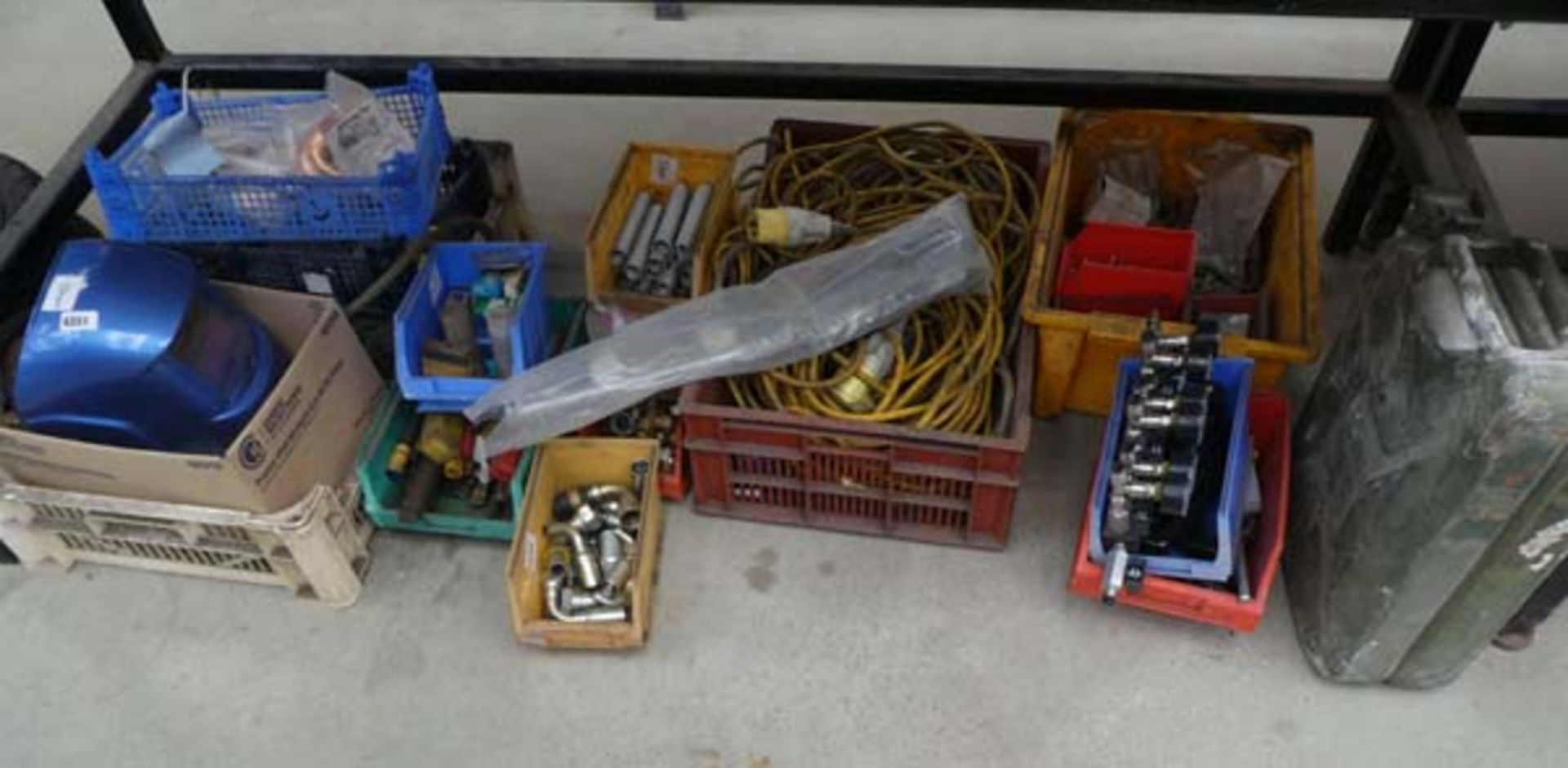 Large underbay of assorted items incl. welding helmet, drill bits, cable, springs, valves, screws,