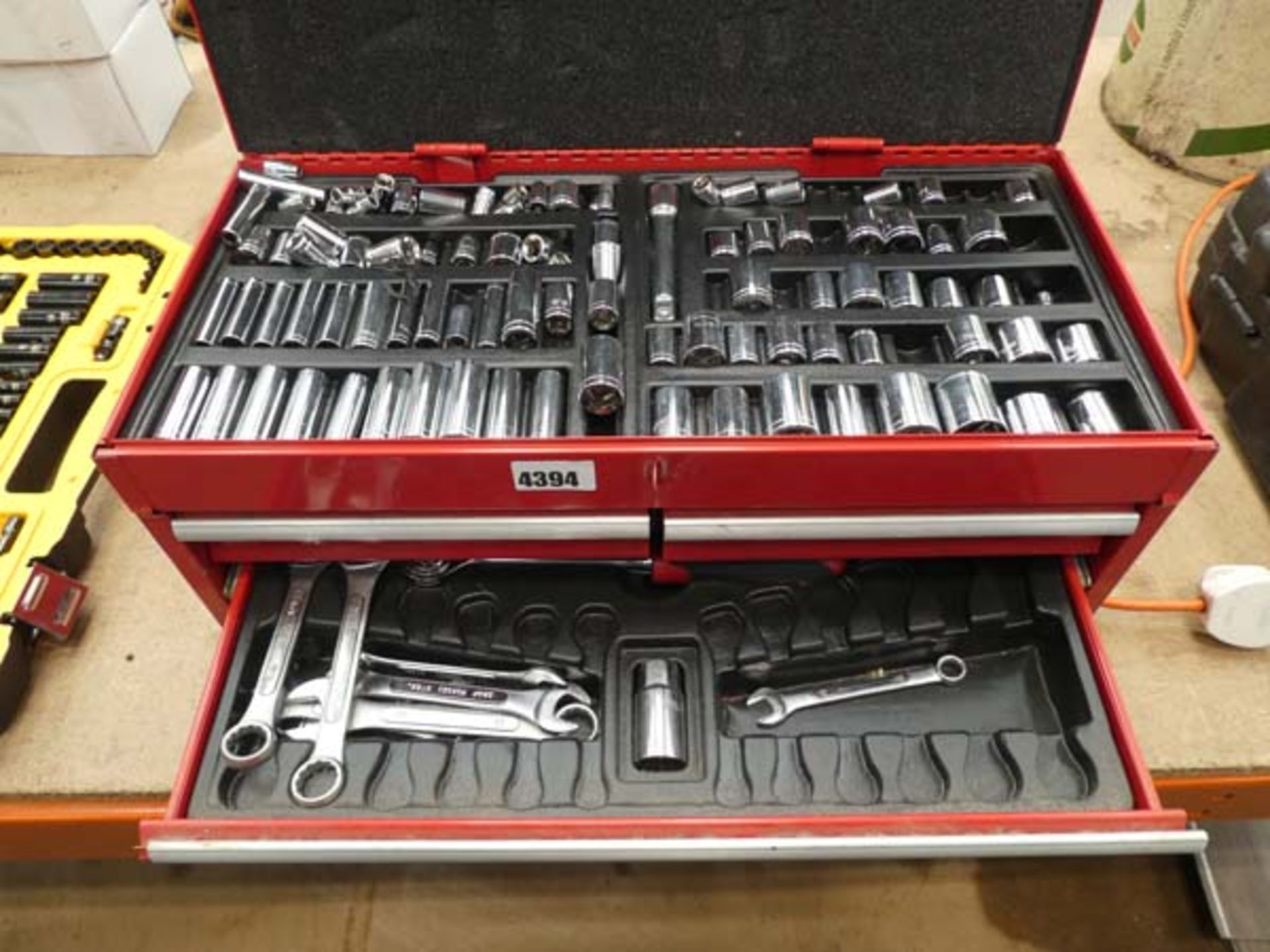 Red toolbox with sockets, spanners, etc.