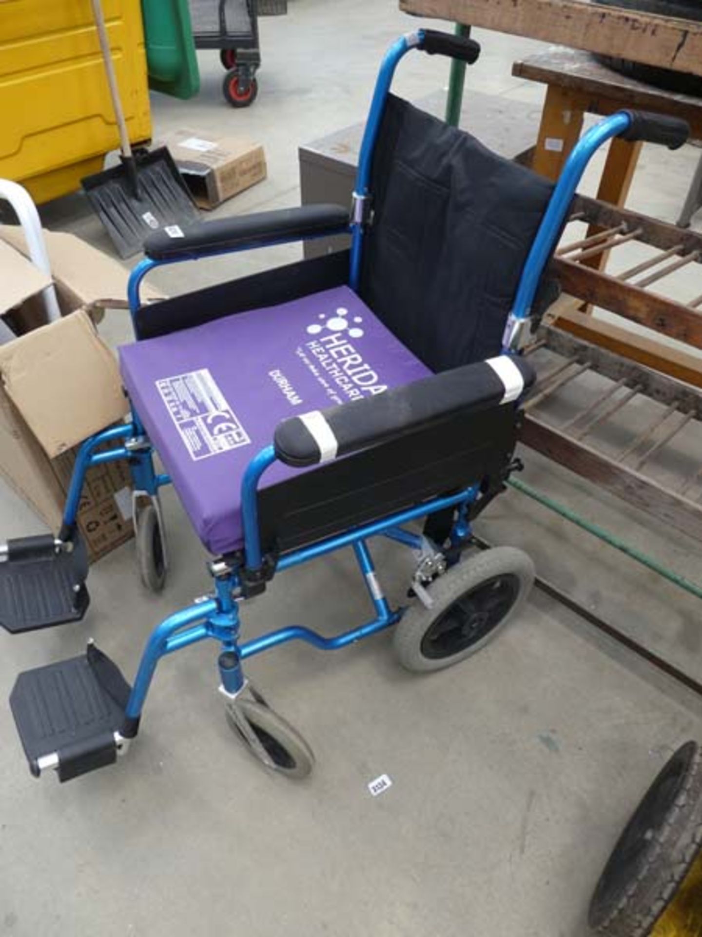 Bright blue foldup wheelchair