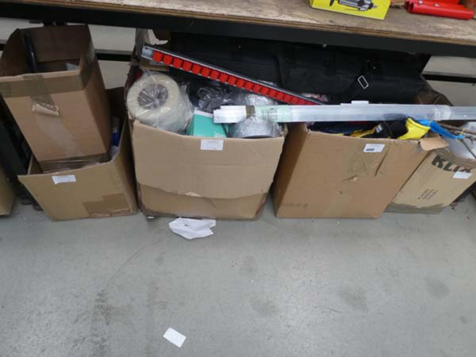 Large underbay containing tools, rollers, gloves, cleaner, varnish, plants, etc.