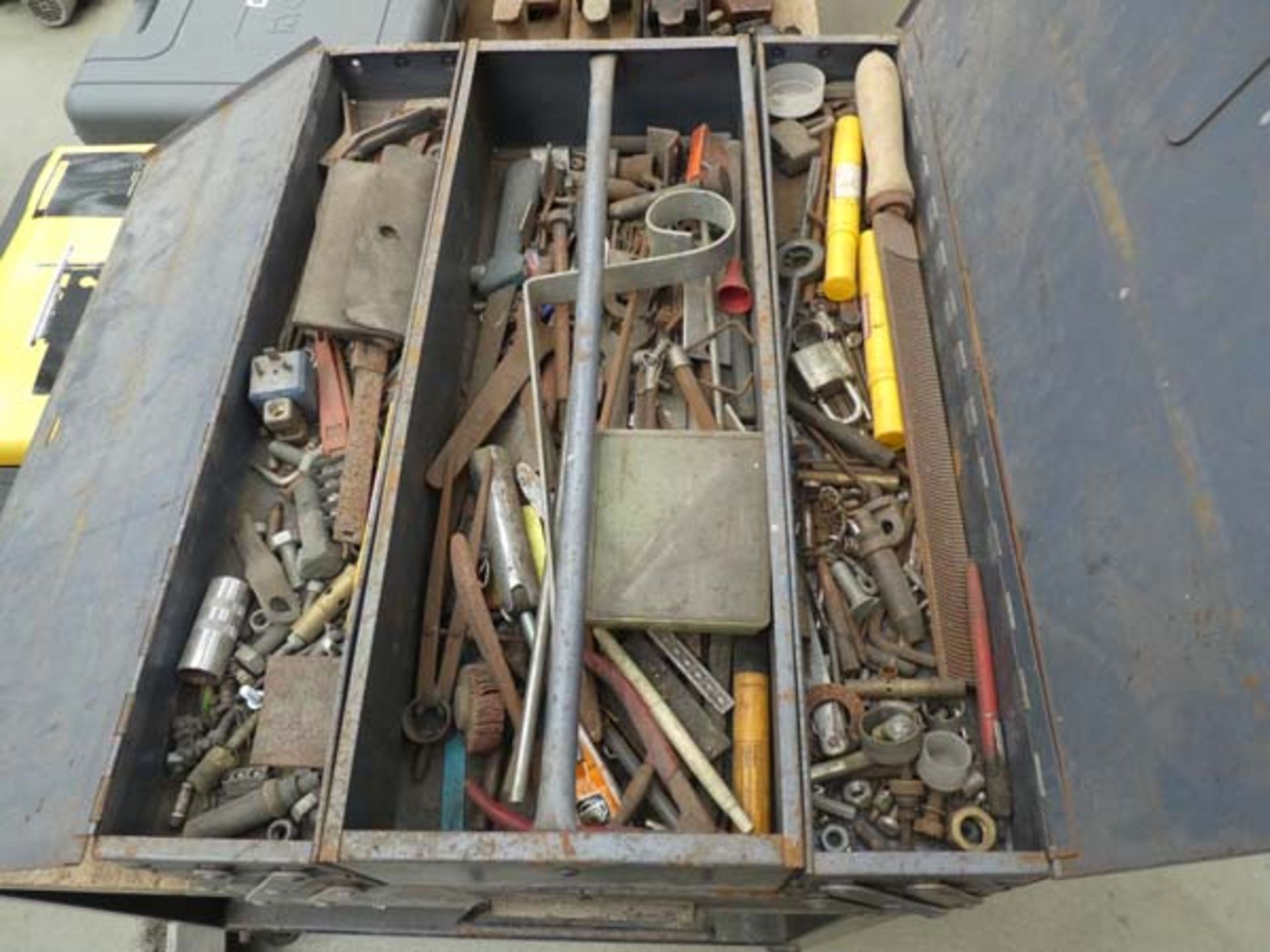 Large wheeled blue toolbox containing small tools and fixings