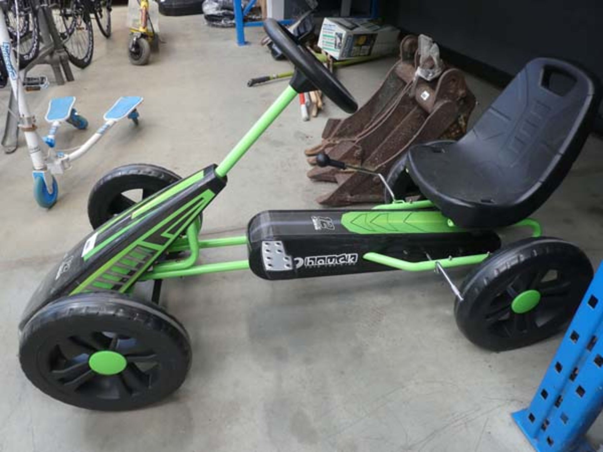 Green and black 4 wheeled go-kart