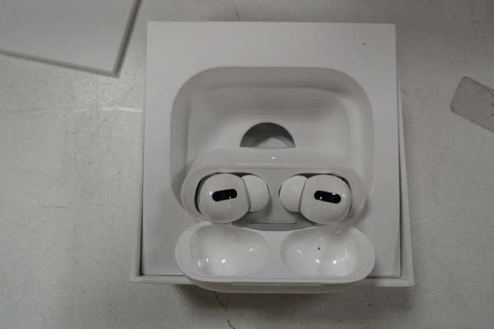 Pair of Apple AirPods Pro with wireless charging case and box