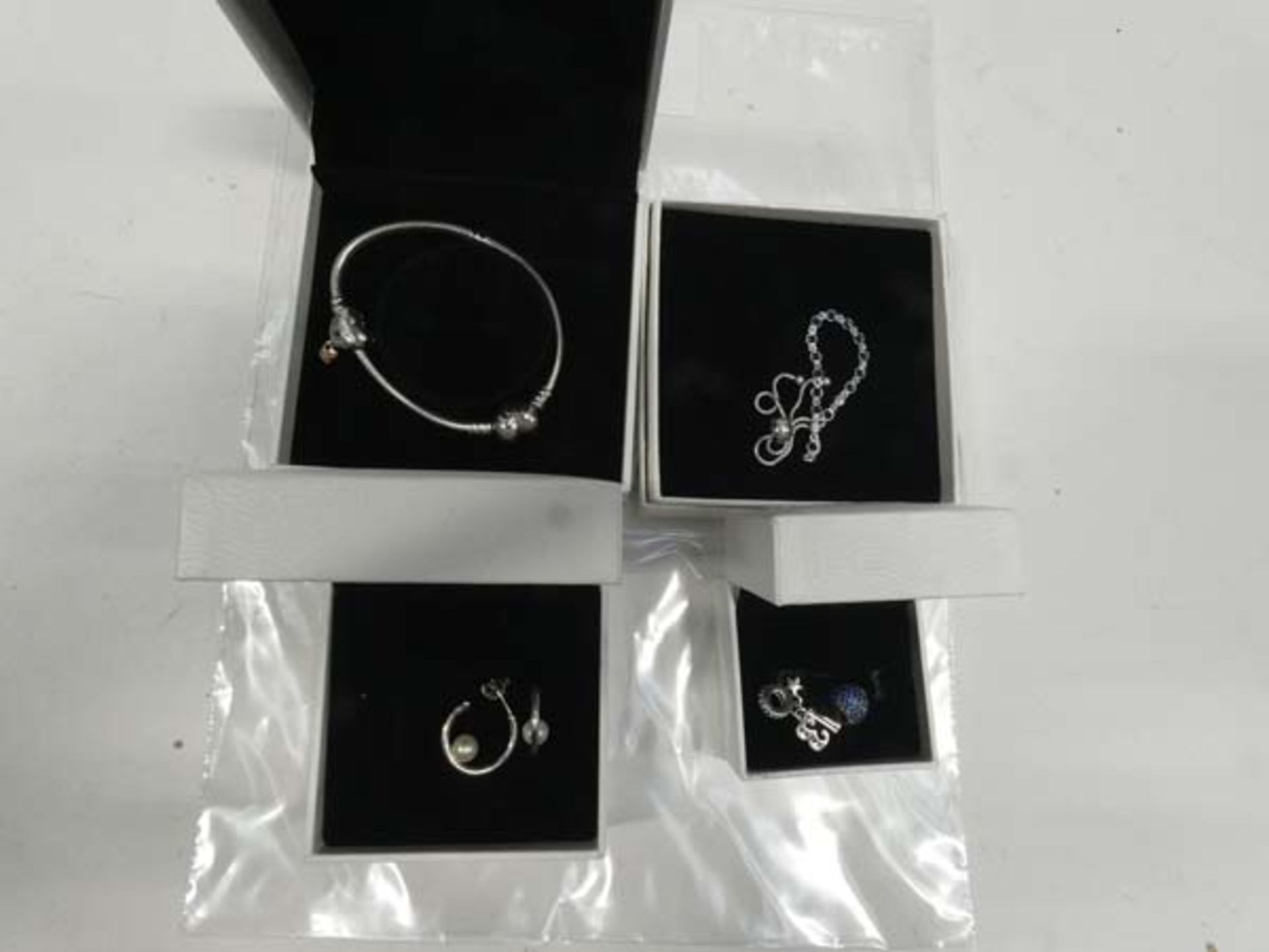 Assortment of Pandora jewellery; bracelets, charms, earrings