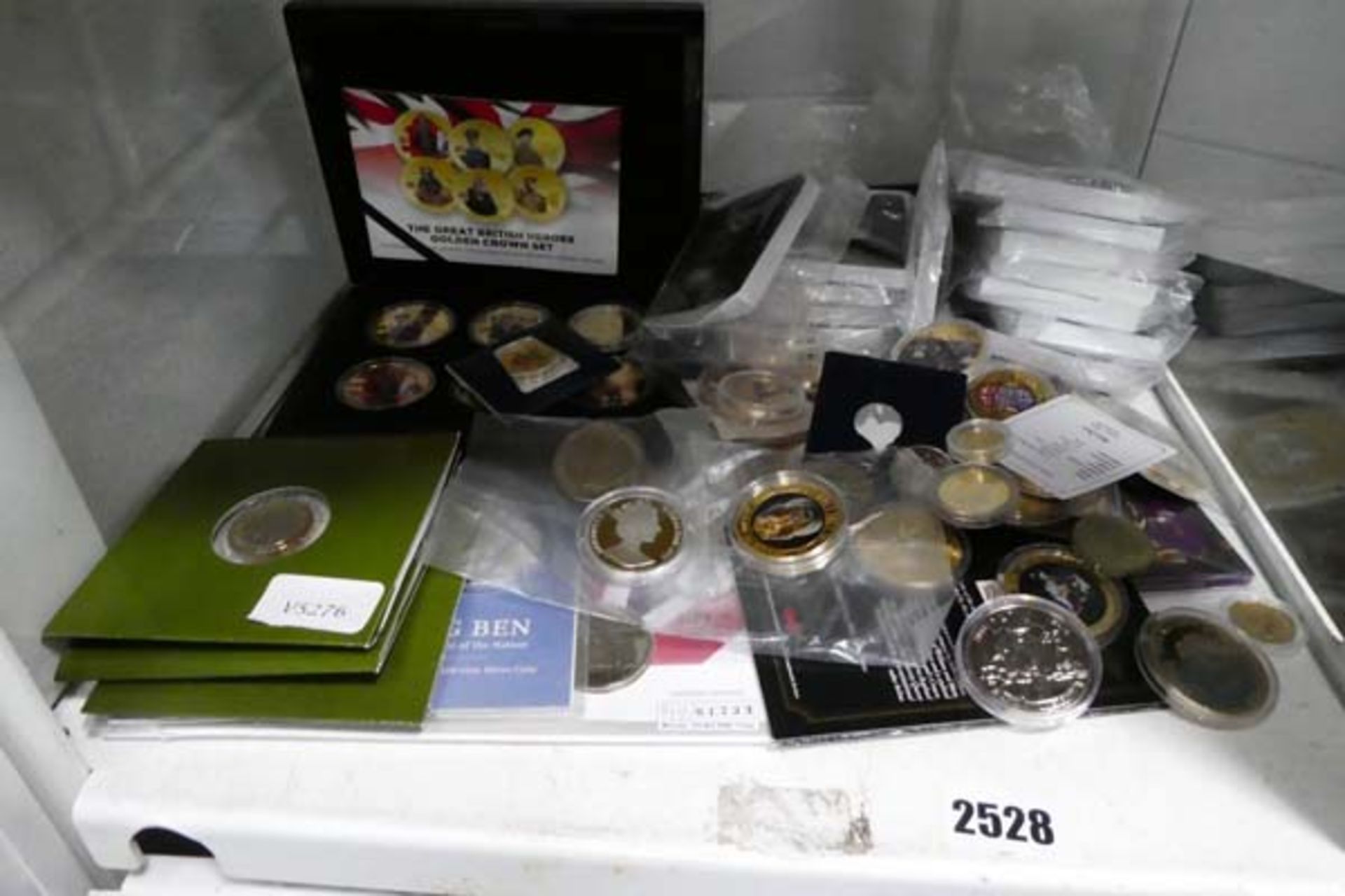 Shelf of commemorative and modern collectable coins