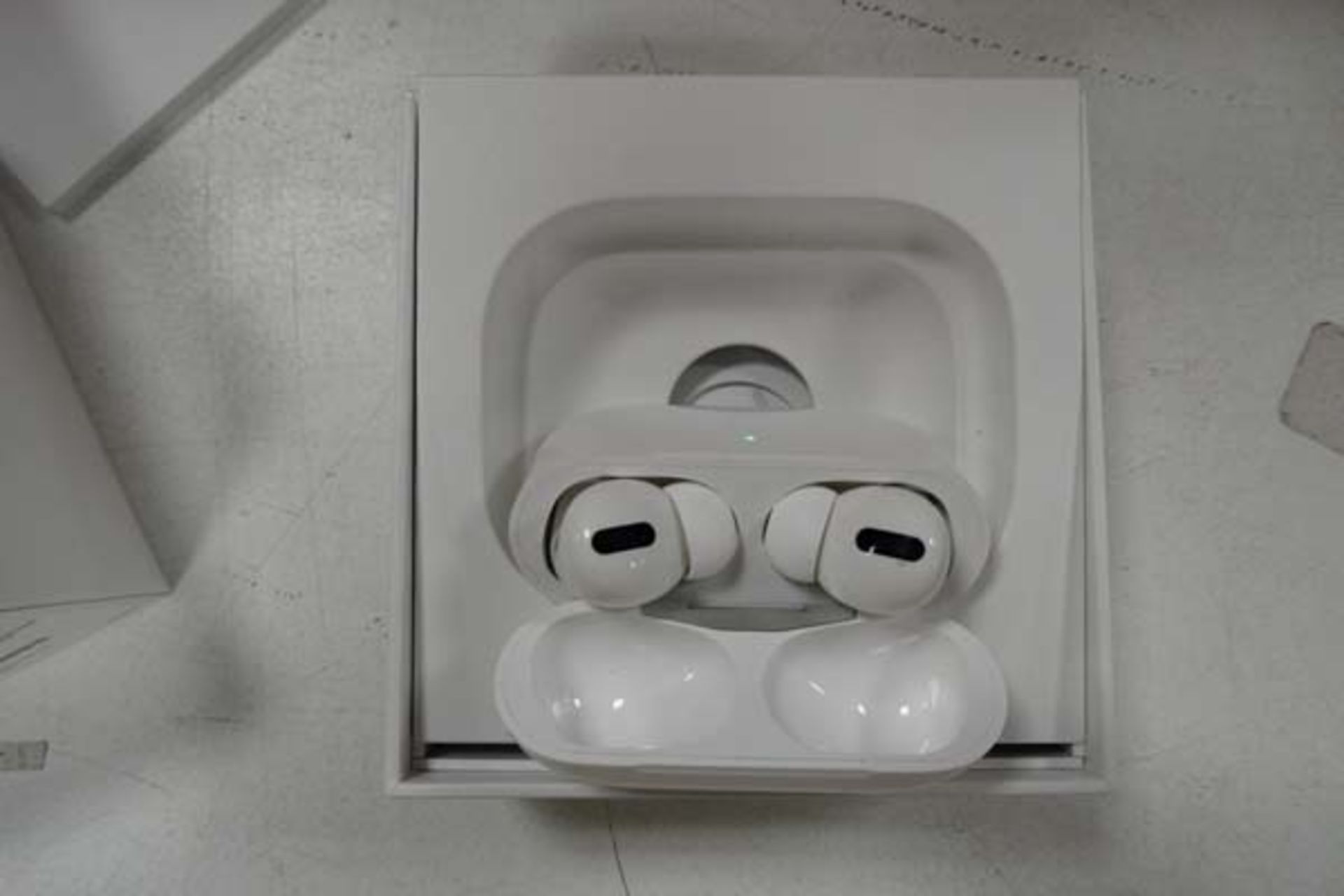 Pair of Apple AirPods Pro with wireless charging case and box