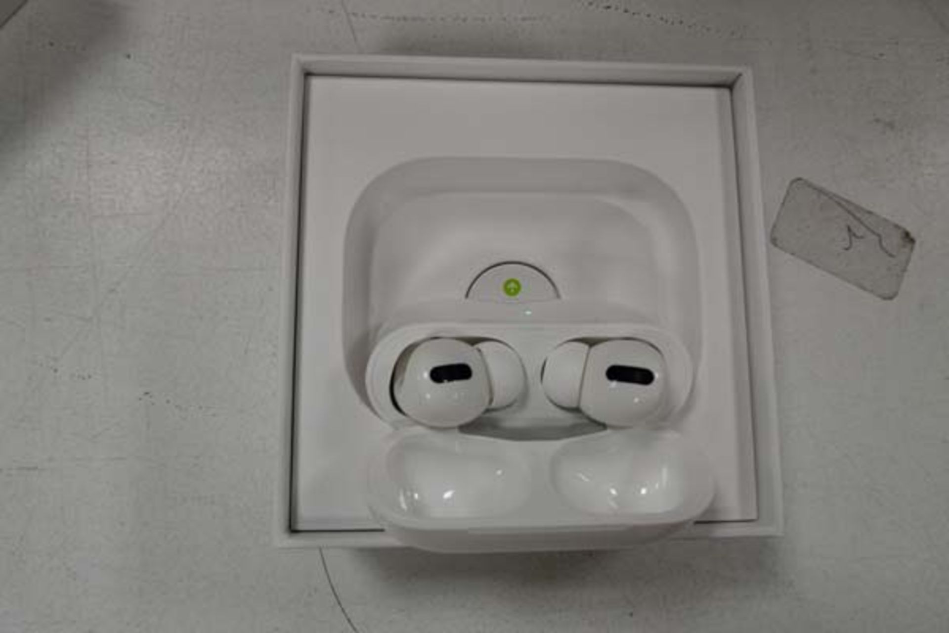 Pair of Apple AirPods Pro with wireless charging case and box