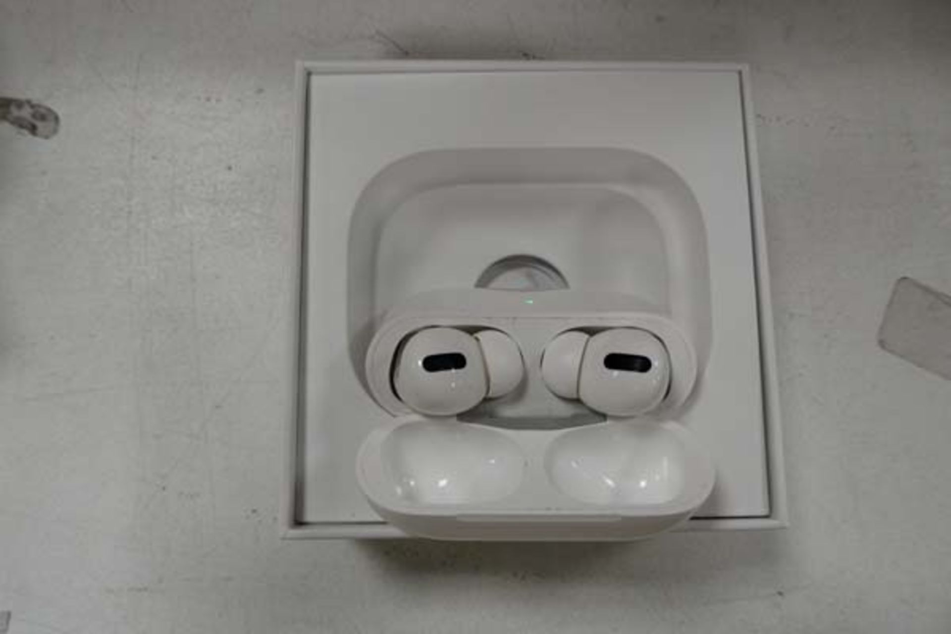 Pair of Apple AirPods Pro with wireless charging case and box