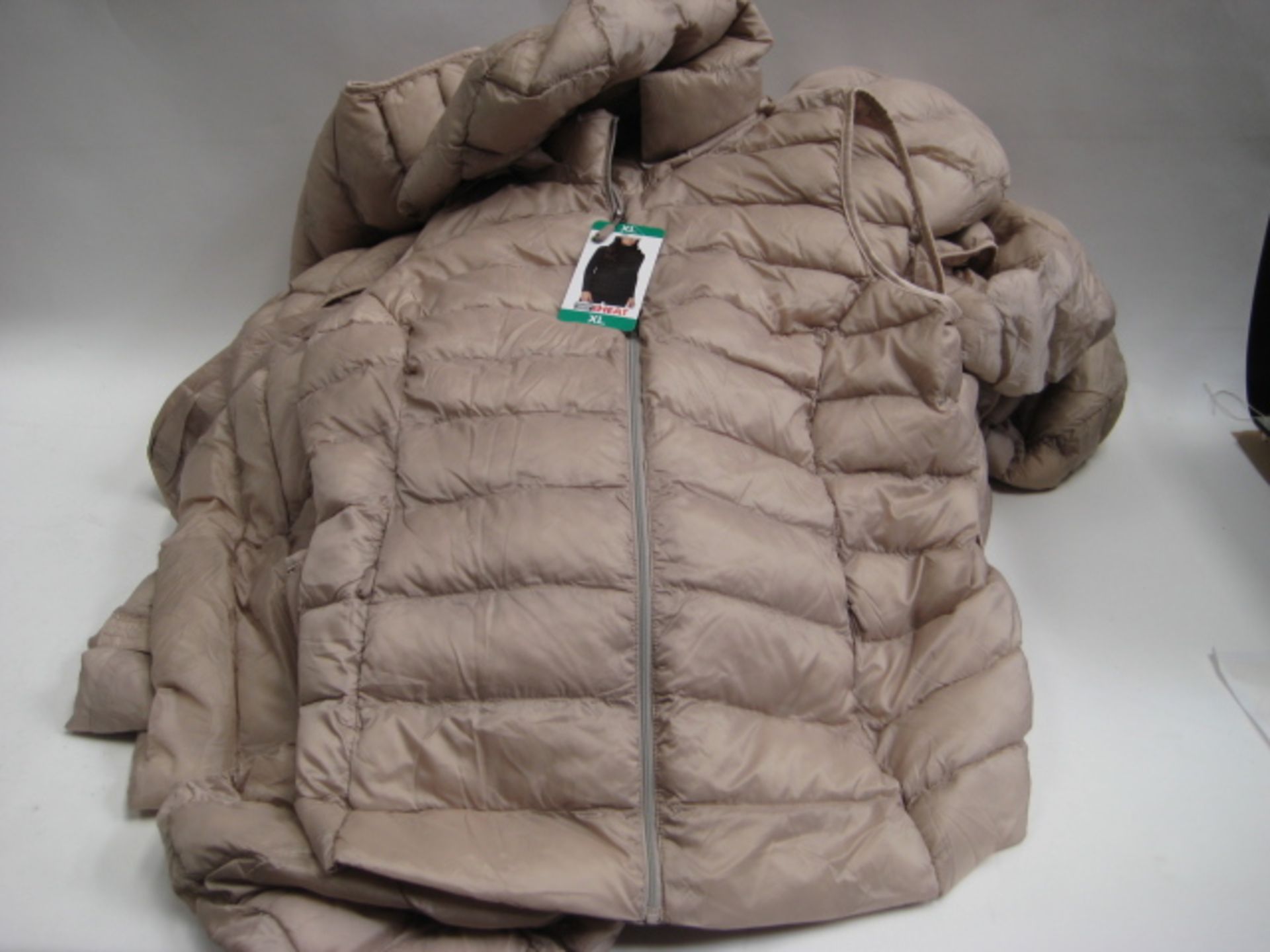 Bag containing 8 32 Degree Heat ladies quilted hooded gilets in 'goat cream'