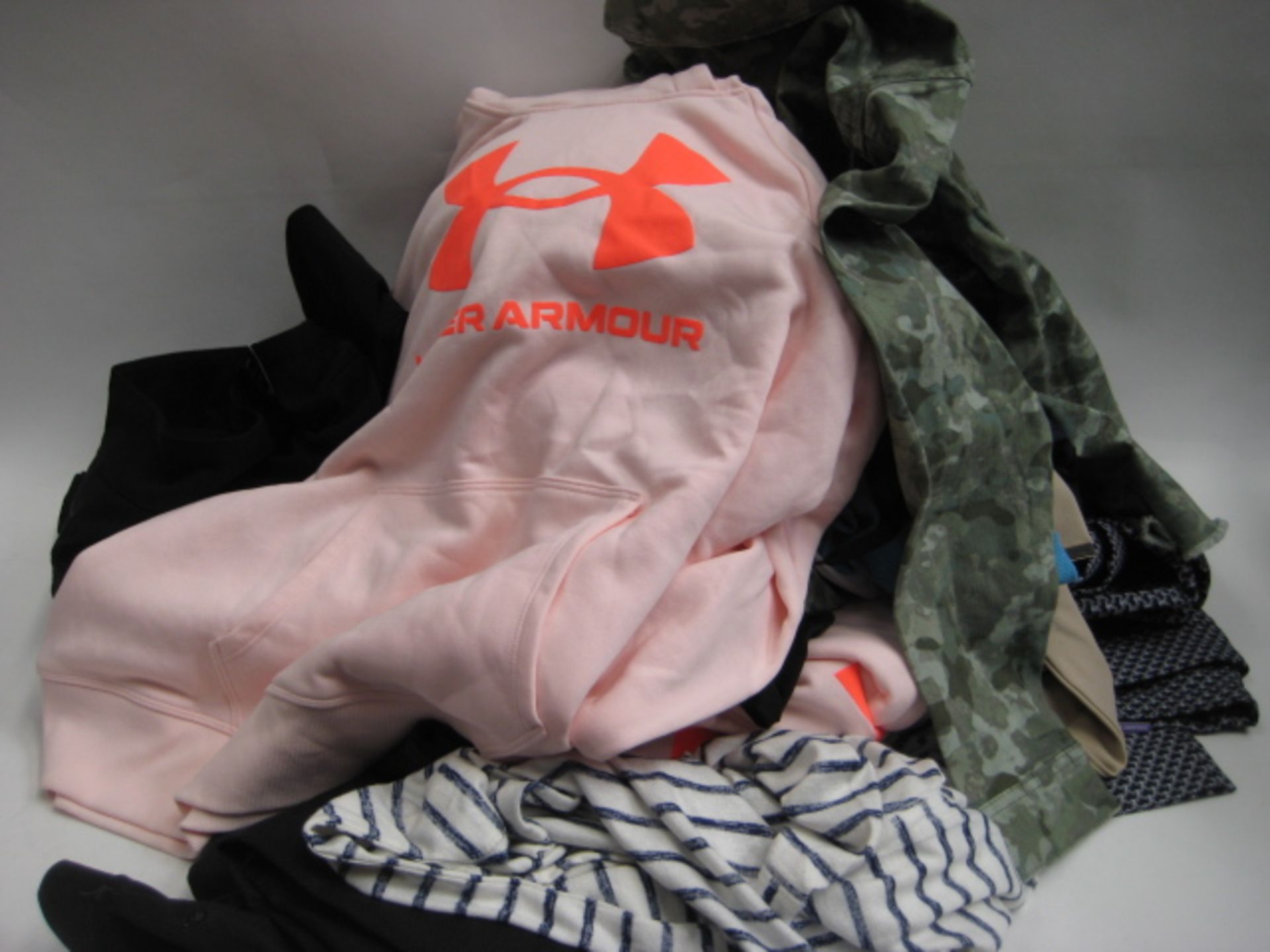 Bag containing ladies clothing to include 2 Under Armour hoodies in pink and light blue, camo jacket