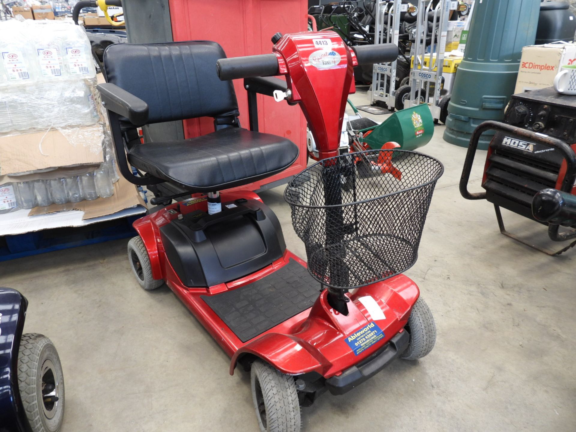 Rascal 4 wheeled red mobility scooter with key