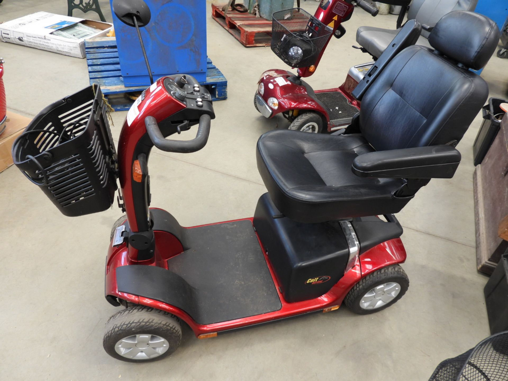 Pride red 4 wheel mobility scooter with key and charger