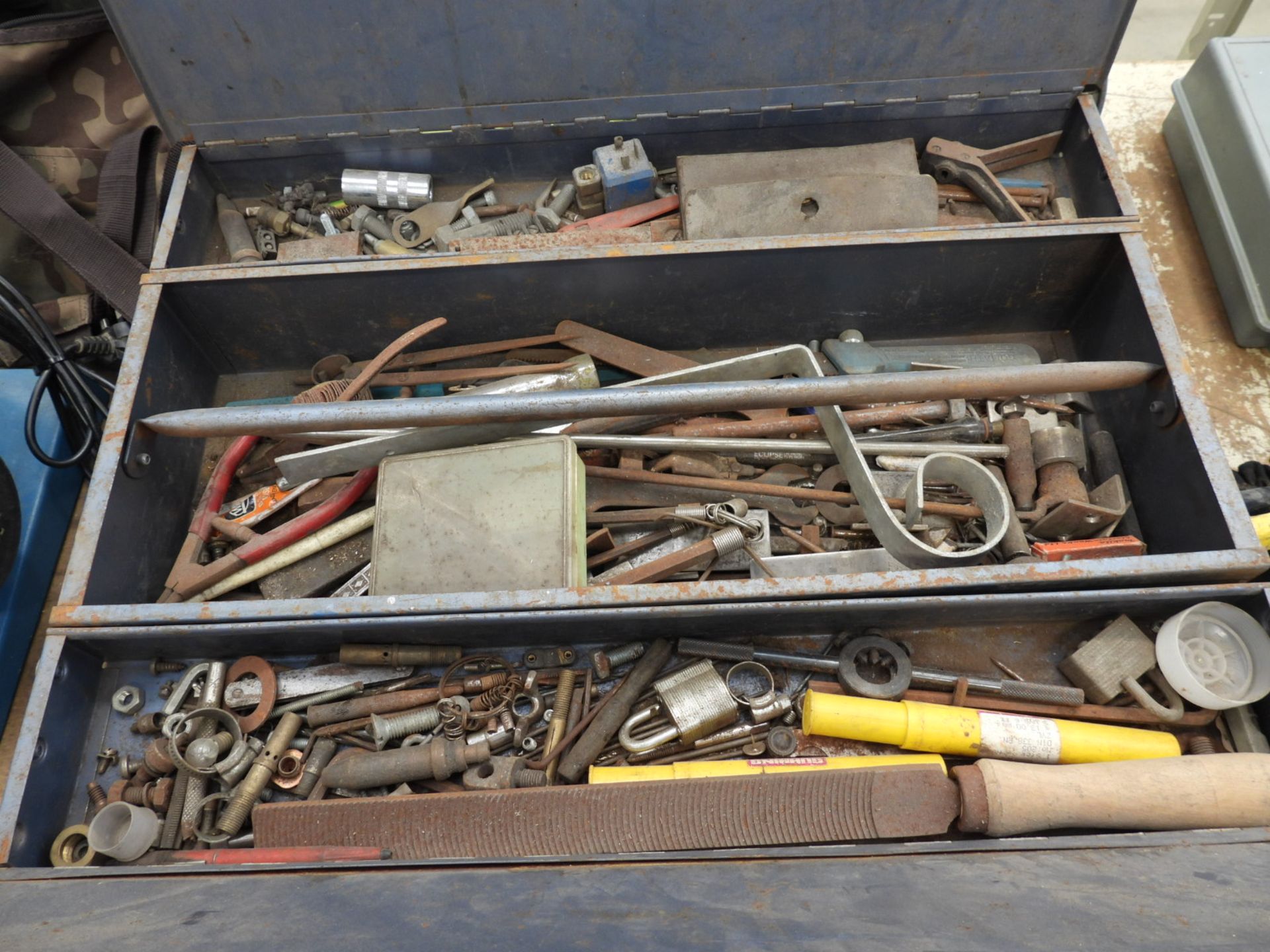 Large blue tool box, containing an assortment of tools