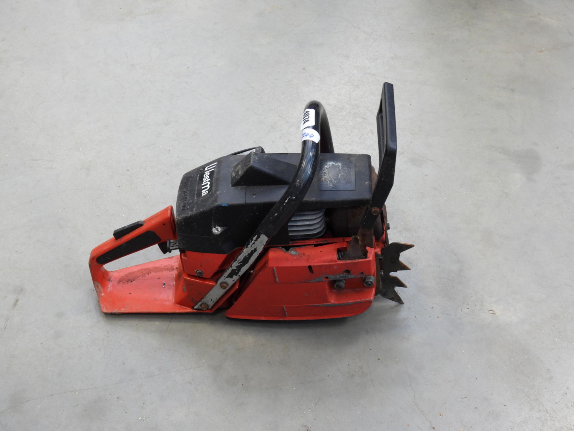 Jonsered red petrol powered chainsaw