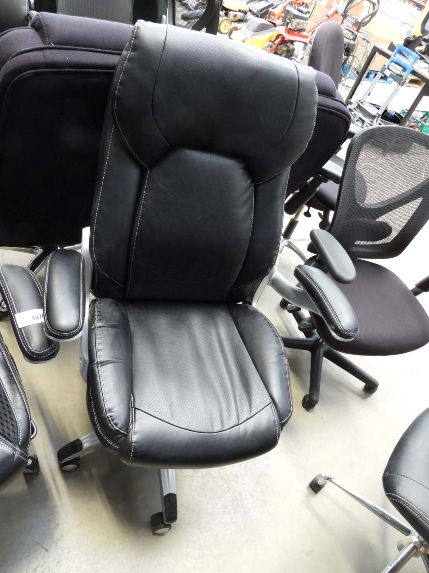 Black high backed executive style swivel armchair