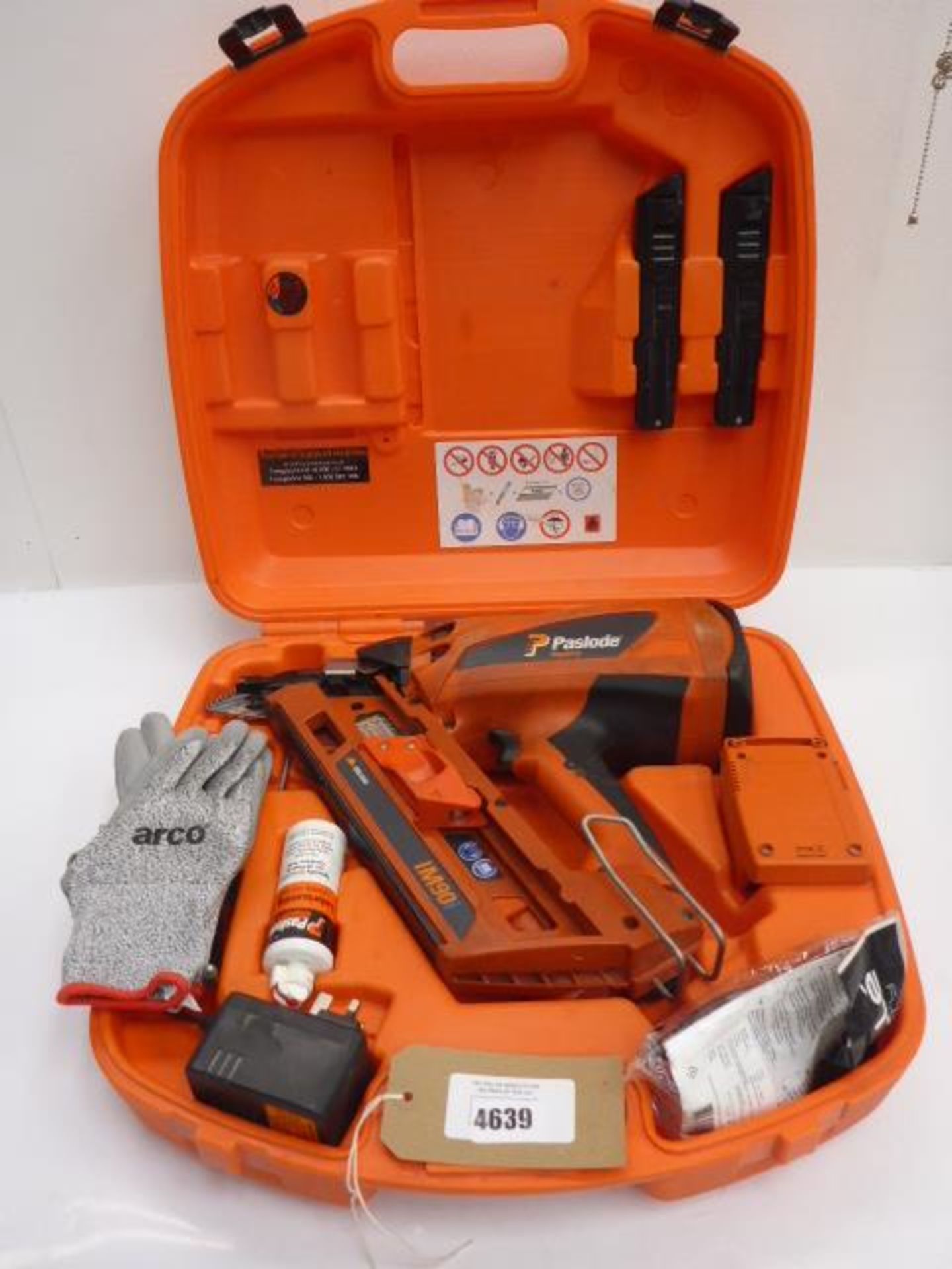 Paslode Impulse IM90 nail gun, charger, safety glasses, lubricant oil and storage case